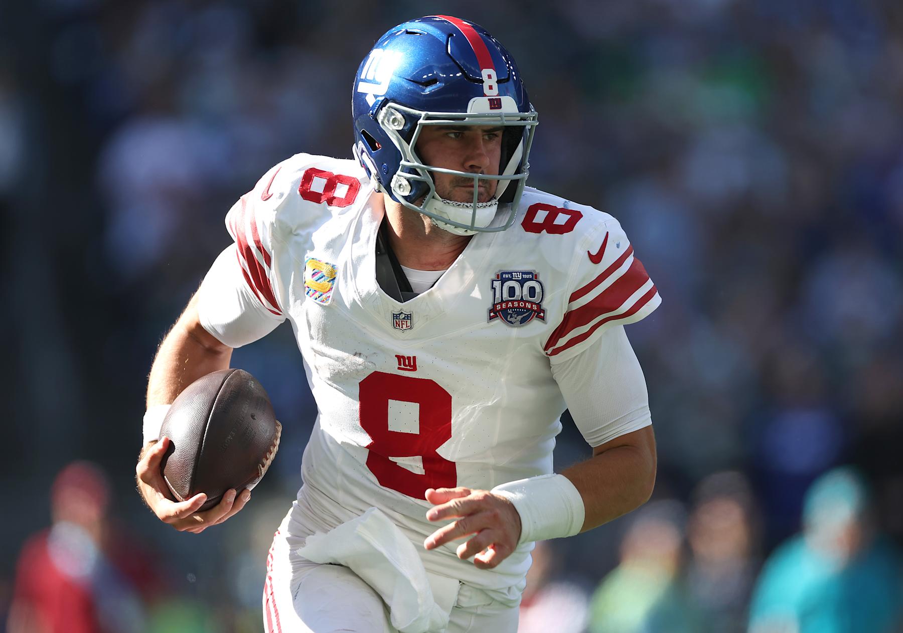 SEATTLE, WASHINGTON - OCTOBER 06: Quarterback Daniel Jones #8 of the New York Giants looks to pass during the first half of a game against the Seattle Seahawks at Lumen Field on October 06, 2024 in Seattle, Washington. (Photo by Steph Chambers/Getty Images)