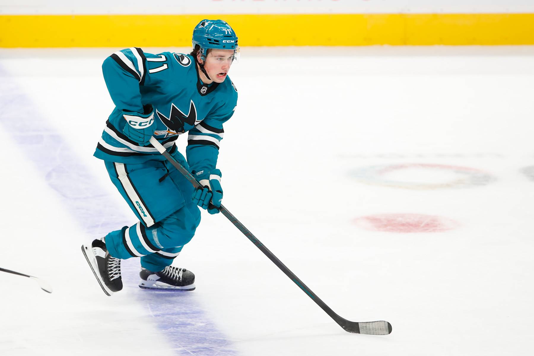 SAN JOSE, CA - OCTOBER 10: San Jose Sharks center Macklin Celebrini (71) skates with the puck during the NHL game between the St. Louis Blues and the San Jose Earthquakes on October 10, 2024 at the SAP Center in San Jose, CA. (Photo by Scott Dinn/Icon Sportswire via Getty Images)