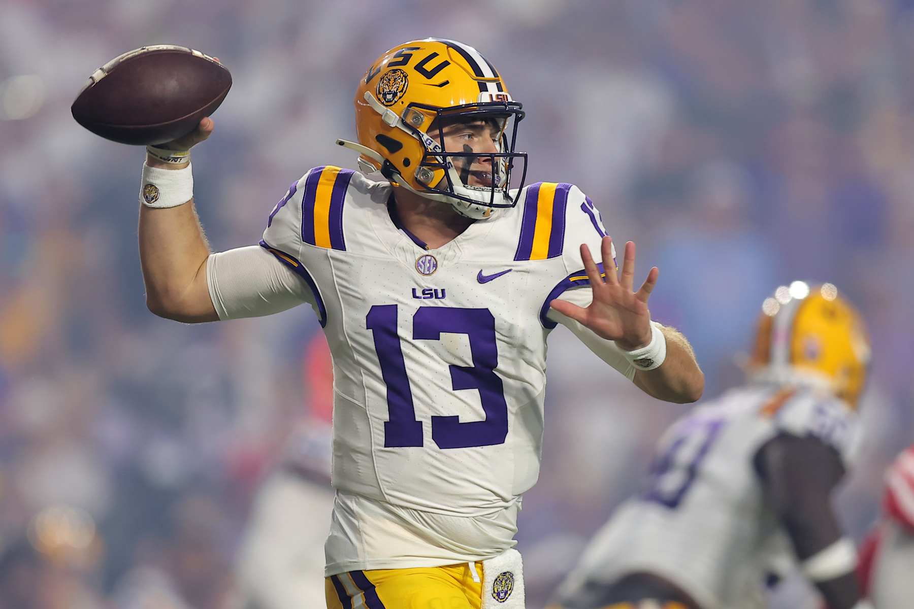 BATON ROUGE, LOUISIANA - OCTOBER 12: Garrett Nussmeier #13 of the LSU Tigers throws the ball during the first half of a game against the Mississippi Rebels at Tiger Stadium on October 12, 2024 in Baton Rouge, Louisiana. (Photo by Jonathan Bachman/Getty Images)