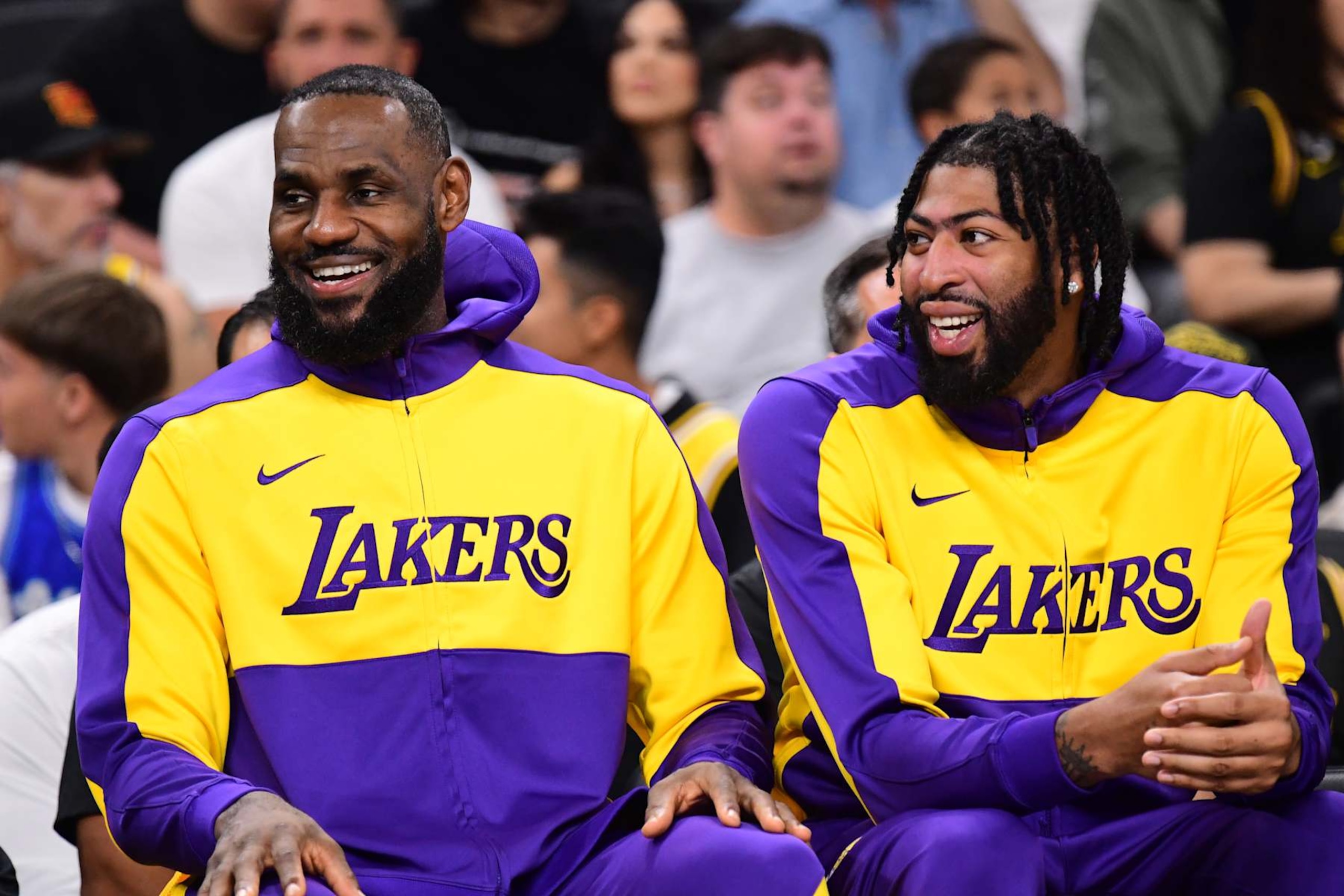 LOS ANGELES, CA - OCTOBER 6: LeBron James #23 and Anthony Davis #3 of the Los Angeles Lakers smiles while sitting on the bench against the Phoenix Suns on October 6, 2024 at Acrisure Arena in Palm Springs, California. NOTE TO USER: User expressly acknowledges and agrees that, by downloading and/or using this Photograph, user is consenting to the terms and conditions of the Getty Images License Agreement. Mandatory Copyright Notice: Copyright 2024 NBAE (Photo by Adam Pantozzi/NBAE via Getty Images) LOS ANGELES, CA - OCTOBER 6: LeBron James #23 and Anthony Davis #3 of the Los Angeles Lakers smiles while sitting on the bench against the Phoenix Suns on October 6, 2024 at Acrisure Arena in Palm Springs, California. NOTE TO USER: User expressly acknowledges and agrees that, by downloading and/or using this Photograph, user is consenting to the terms and conditions of the Getty Images License Agreement. Mandatory Copyright Notice: Copyright 2024 NBAE (Photo by Adam Pantozzi/NBAE via Getty Images)