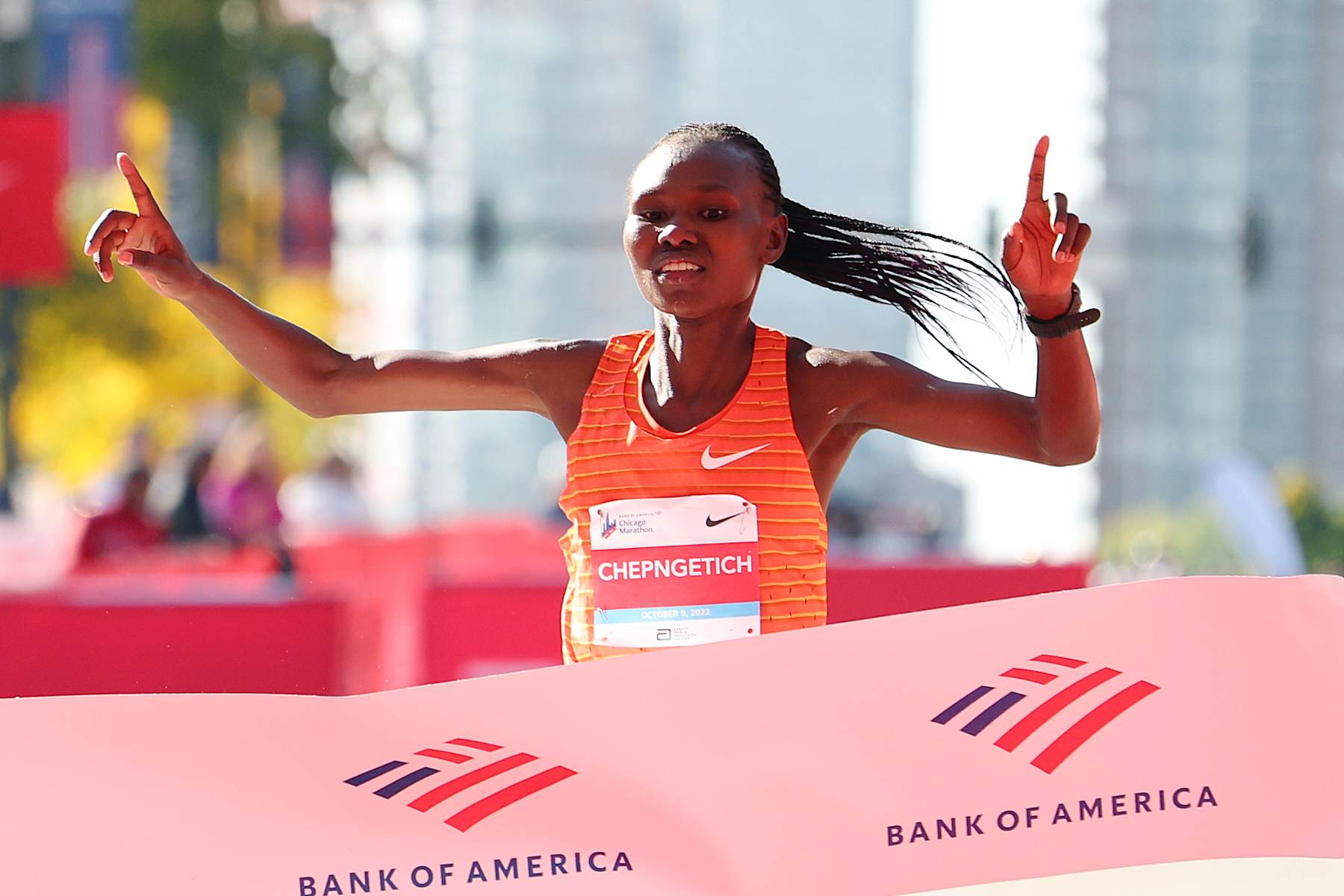 CHICAGO, ILLINOIS - OCTOBER 09: Ruth Chepngetich of Kenya celebrates as she crosses the finish line to win the professional women's division of the 2022 Chicago Marathon on October 09, 2022 in Chicago, Illinois. (Photo by Michael Reaves/Getty Images)