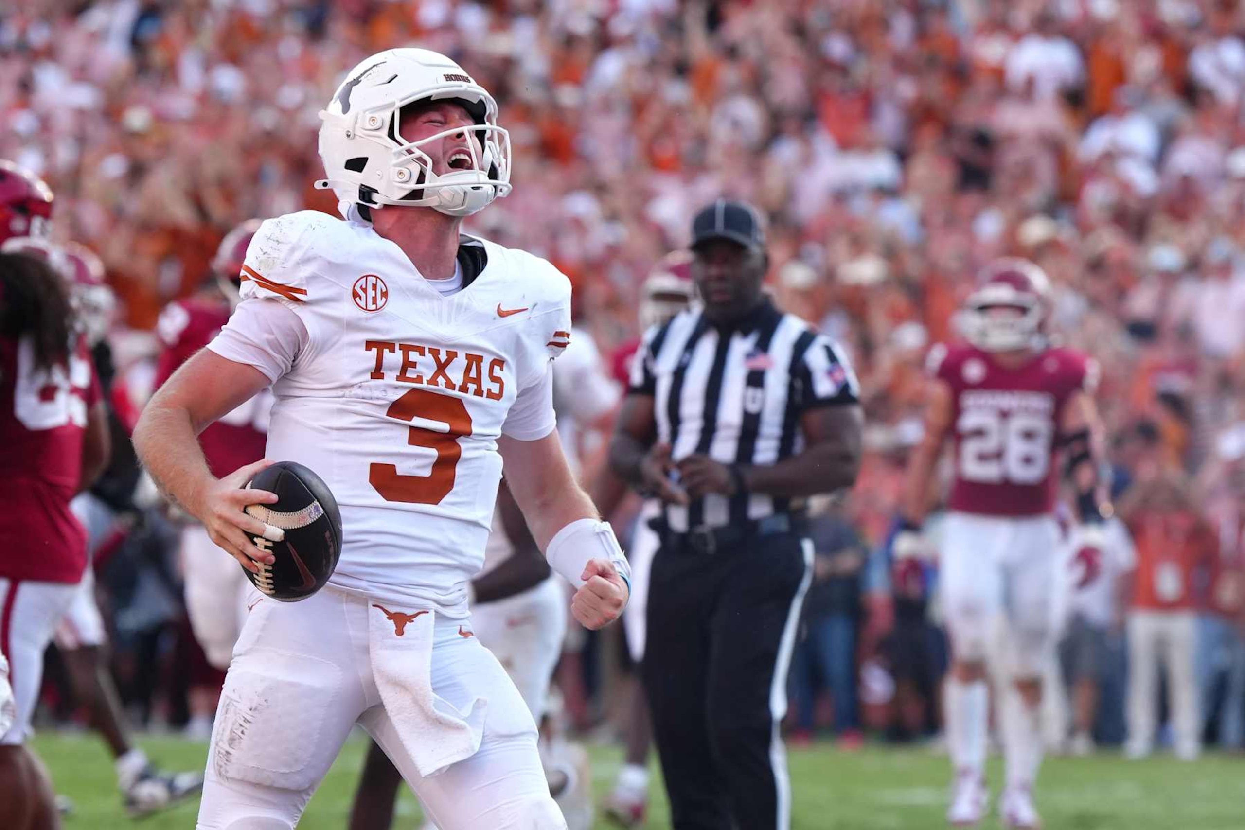 DALLAS, TEXAS - OCTOBER 12: Quinn Ewers #3 of the Texas Longhorns celebrates after scoring a touchdown during the fourth quarter against the Oklahoma Sooners at Cotton Bowl Stadium on October 12, 2024 in Dallas, Texas. (Photo by Sam Hodde/Getty Images) DALLAS, TEXAS - OCTOBER 12: Quinn Ewers #3 of the Texas Longhorns celebrates after scoring a touchdown during the fourth quarter against the Oklahoma Sooners at Cotton Bowl Stadium on October 12, 2024 in Dallas, Texas. (Photo by Sam Hodde/Getty Images)