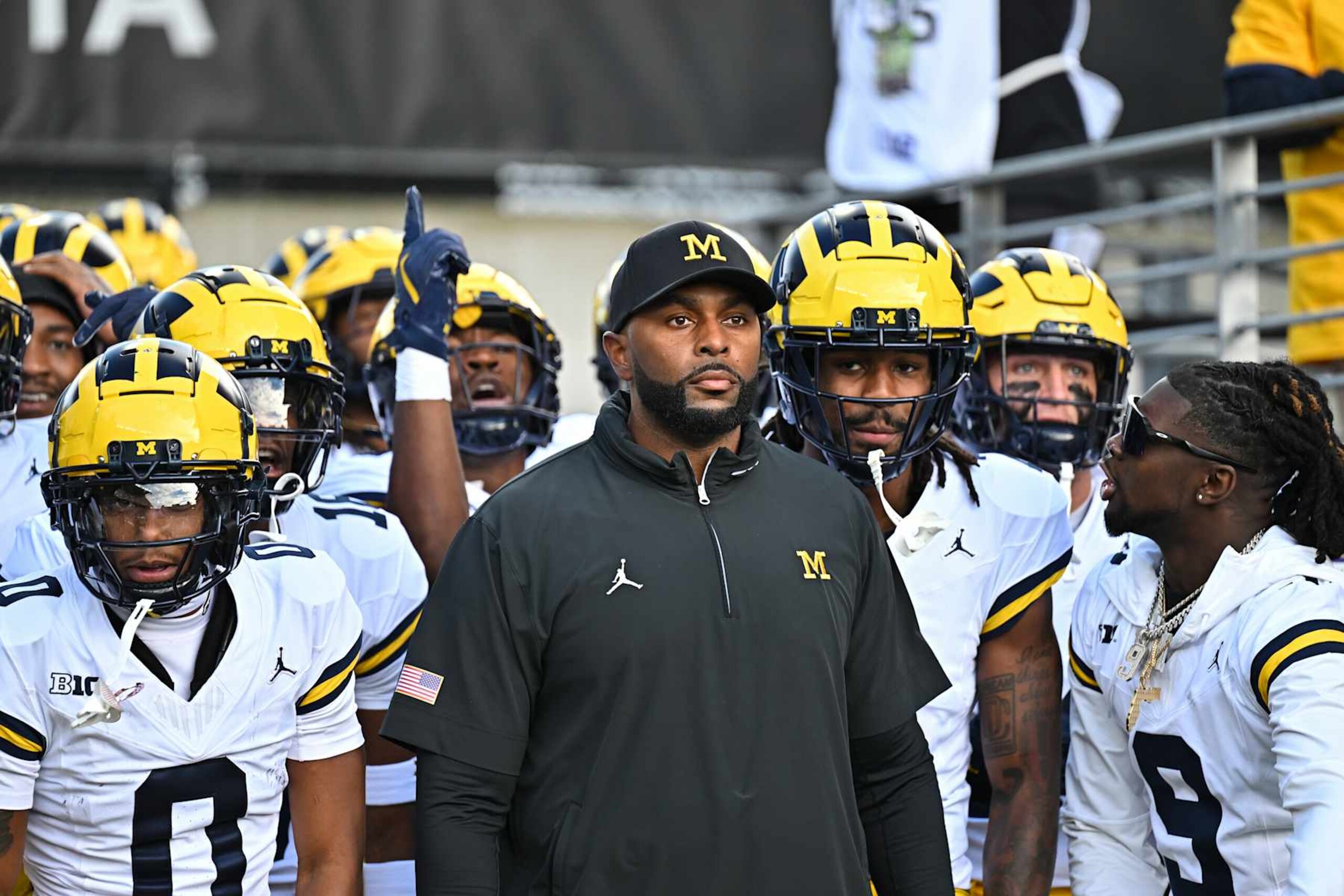 SEATTLE, WASHINGTON - OCTOBER 05: Head coach Sherrone Moore of the Michigan Wolverines stands with his team before the game against the Washington Huskies at Husky Stadium on October 05, 2024 in Seattle, Washington. The Washington Huskies won 27-17. (Photo by Alika Jenner/Getty Images)