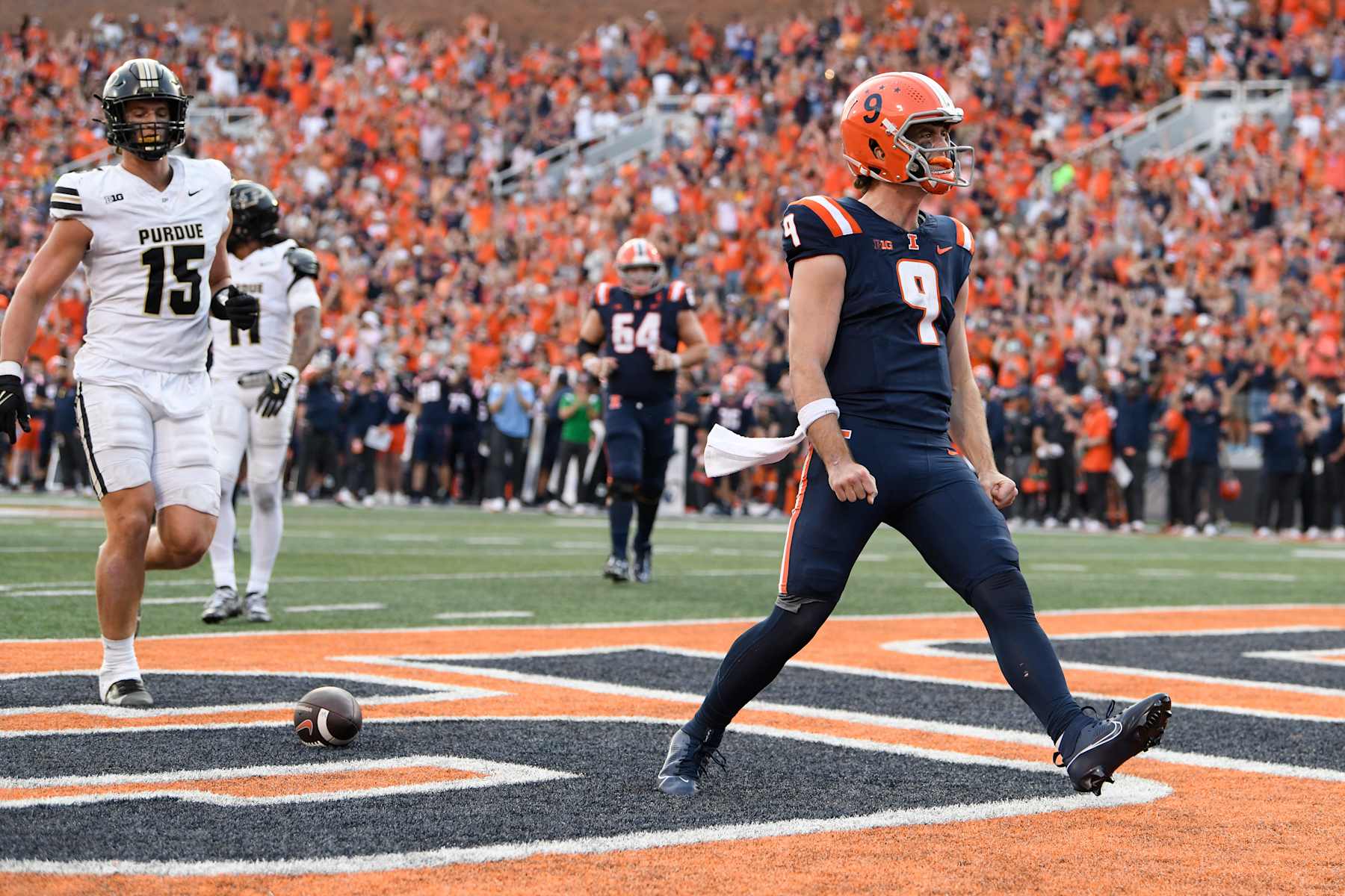 CHAMPAIGN, IL - OCTOBER 12: Illinois Fighting Illini Quarterback Luke Altmyer (9) celebrates after scoring a touchdown during the college football game between the Purdue Boilermakers and the Illinois Fighting Illini on October 12, 2024, at Memorial Stadium in Champaign, Illinois. (Photo by Michael Allio/Icon Sportswire via Getty Images)