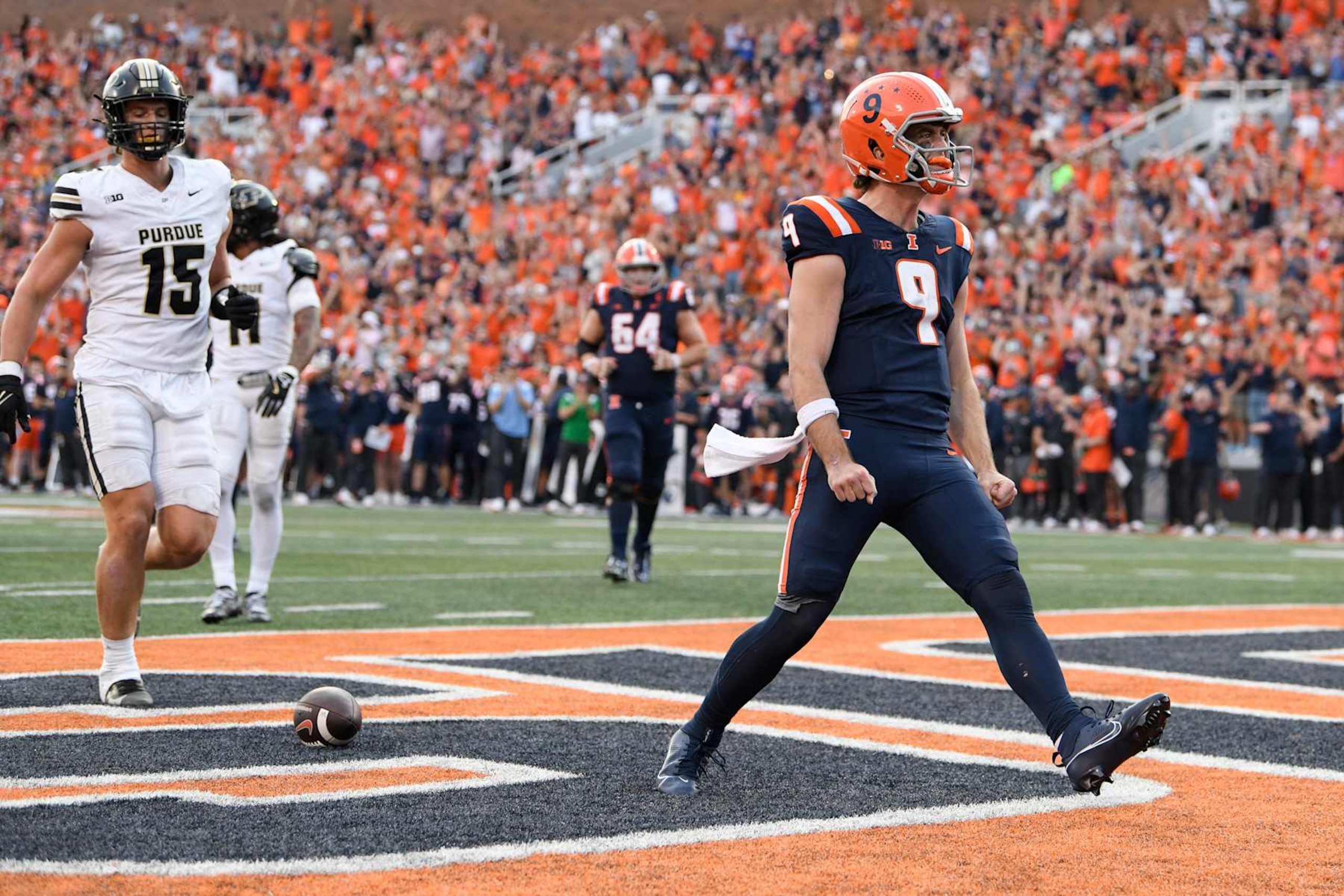 CHAMPAIGN, IL - OCTOBER 12: Illinois Fighting Illini Quarterback Luke Altmyer (9) celebrates after scoring a touchdown during the college football game between the Purdue Boilermakers and the Illinois Fighting Illini on October 12, 2024, at Memorial Stadium in Champaign, Illinois. (Photo by Michael Allio/Icon Sportswire via Getty Images)