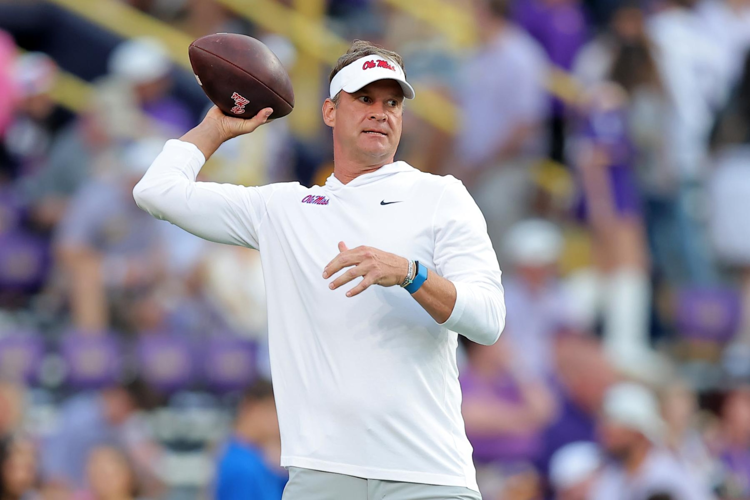 BATON ROUGE, LOUISIANA - OCTOBER 12: Head coach Lane Kiffin of the Mississippi Rebels throws the ball before a game against the LSU Tigers at Tiger Stadium on October 12, 2024 in Baton Rouge, Louisiana. (Photo by Jonathan Bachman/Getty Images)