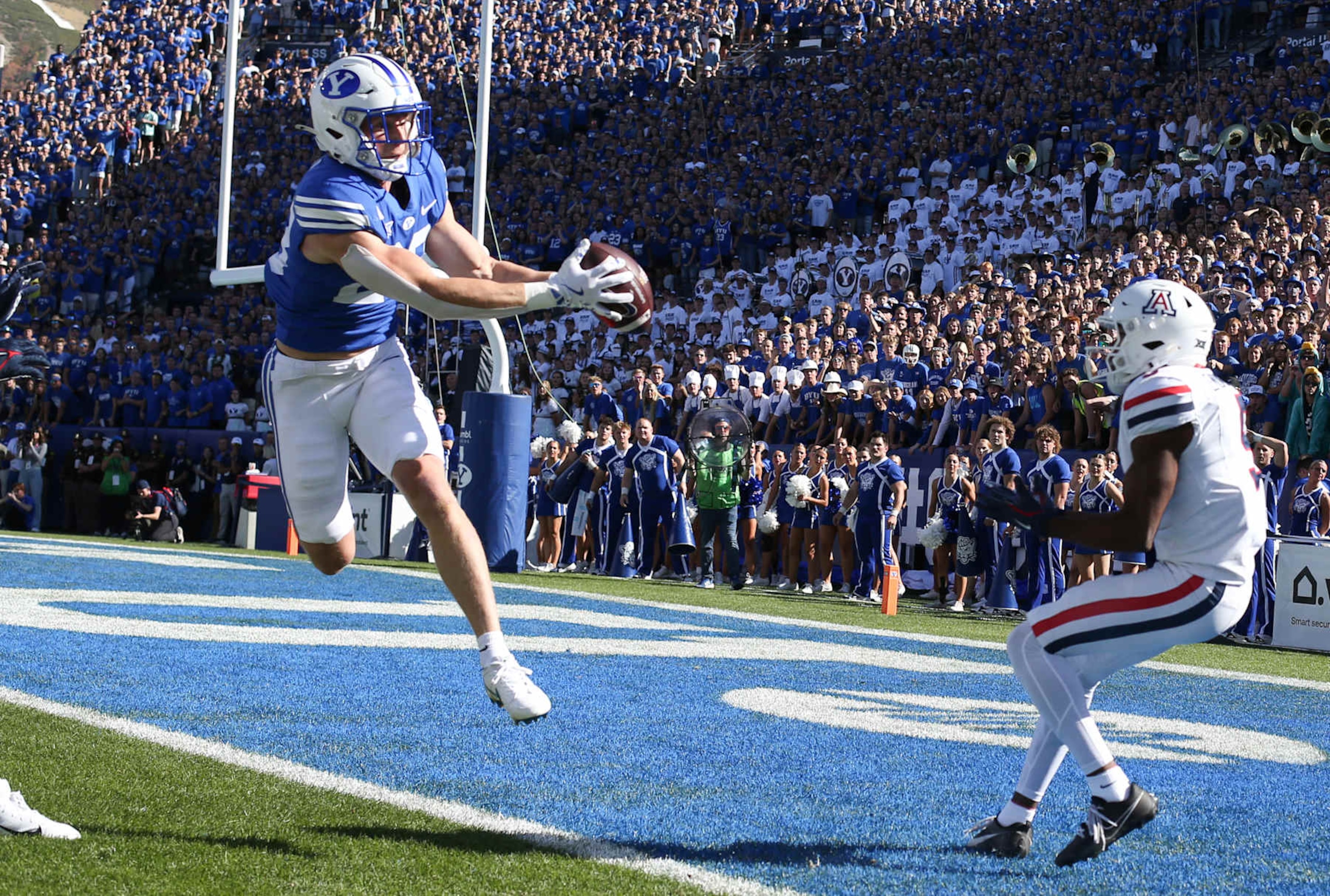 PROVO, UT - OCTOBER 12: Tanner Wall #28 of the Brigham Young Cougars intercepts a pass intended for Montana Lemonious-Craig #5 of the Arizona Wildcats during the first half of their game at LaVell Edwards Stadium on October 12, 2024 in Provo, Utah.(Photo by Chris Gardner/Getty Images)
