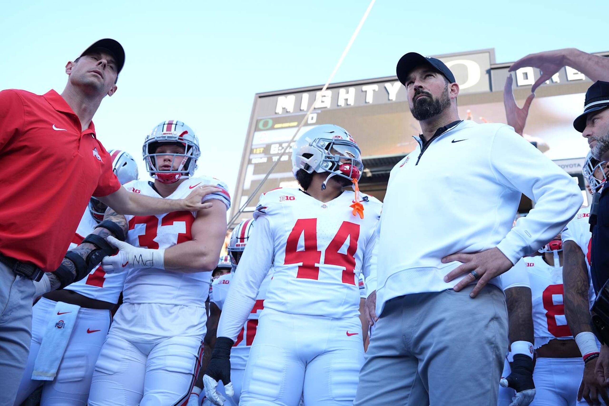 EUGENE, OREGON - OCTOBER 12: (R) Head coach Ryan Day of the Ohio State Buckeyes prepares to take the field with his team prior to a game against the Oregon Ducks at Autzen Stadium on October 12, 2024 in Eugene, Oregon. (Photo by Ali Gradischer/Getty Images)