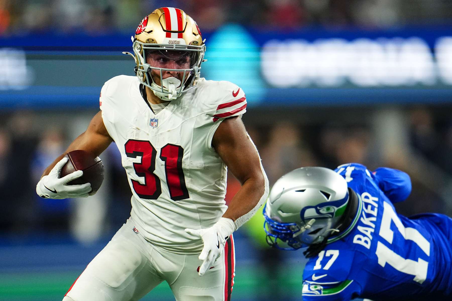 SEATTLE, WA - OCTOBER 10: Isaac Guerendo #31 of the San Francisco 49ers runs the ball during an NFL football game against the Seattle Seahawks at Lumen Field on October 10, 2024 in Seattle, Washington. (Photo by Cooper Neill/Getty Images)