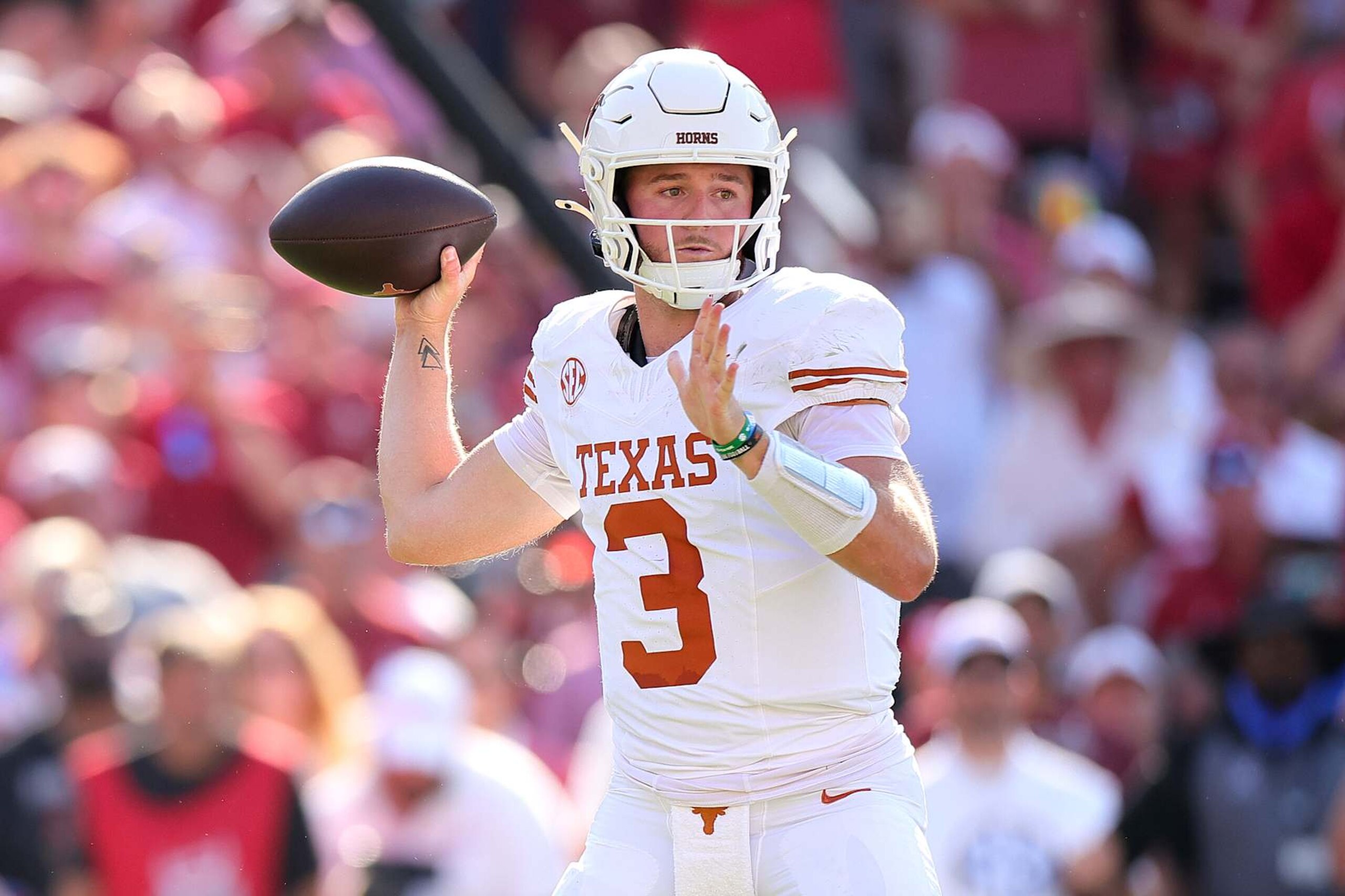 DALLAS, TEXAS - OCTOBER 12: Quinn Ewers #3 of the Texas Longhorns throws the ball during the second quarter against the Oklahoma Sooners at Cotton Bowl Stadium on October 12, 2024 in Dallas, Texas. (Photo by Alex Slitz/Getty Images)