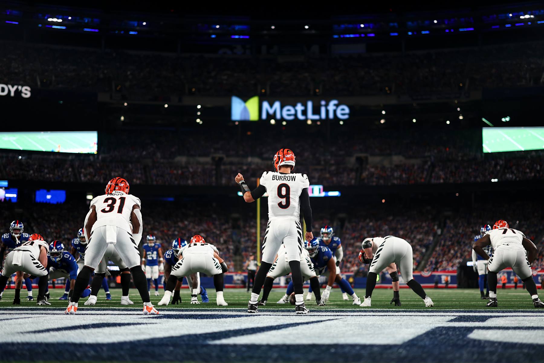 EAST RUTHERFORD, NEW JERSEY - OCTOBER 13: Joe Burrow #9 of the Cincinnati Bengals calls a play at the line of scrimmage during the first half of an NFL game against the New York Giants at MetLife Stadium on October 13, 2024 in East Rutherford, New Jersey. (Photo by Kevin Sabitus/Getty Images)