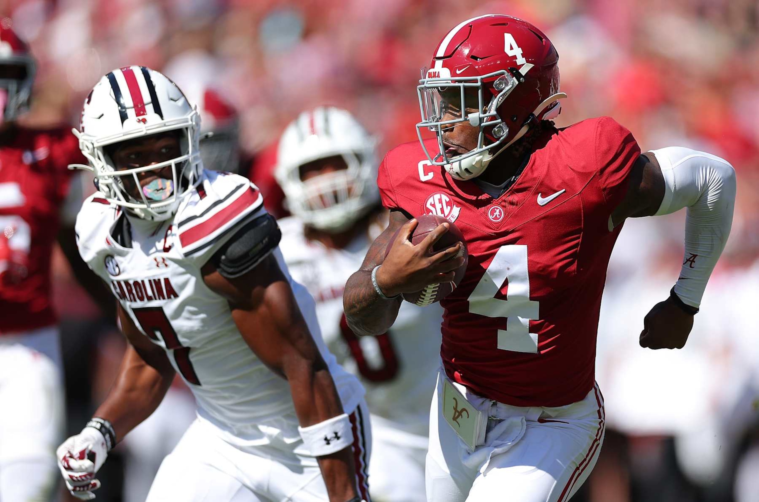 TUSCALOOSA, ALABAMA - OCTOBER 12:  Jalen Milroe #4 of the Alabama Crimson Tide rushes away from the South Carolina Gamecocks during the second quarter at Bryant-Denny Stadium on October 12, 2024 in Tuscaloosa, Alabama. (Photo by Kevin C. Cox/Getty Images)