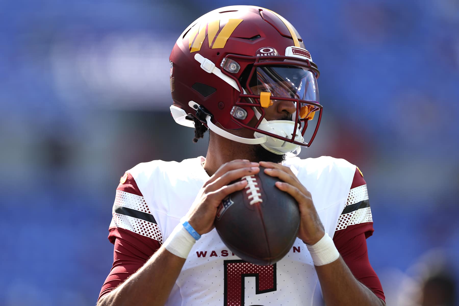 BALTIMORE, MARYLAND - OCTOBER 13: Jayden Daniels #5 of the Washington Commanders warms up prior to the game against the Baltimore Ravens at M&T Bank Stadium on October 13, 2024 in Baltimore, Maryland. (Photo by Patrick Smith/Getty Images)