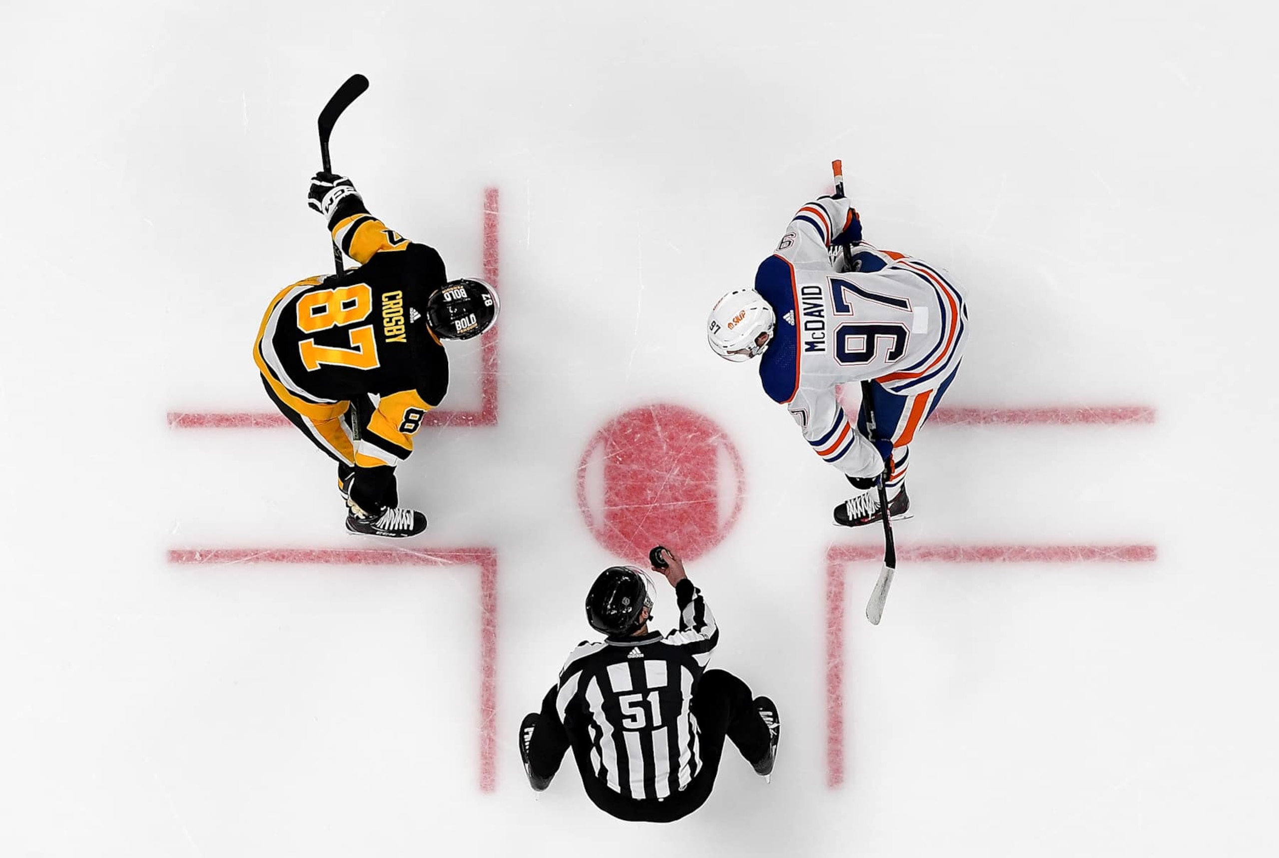 Pittsburgh Penguins captain Sidney Crosby (left) and Edmonton Oilers captain Connor McDavid prepare to face off. 