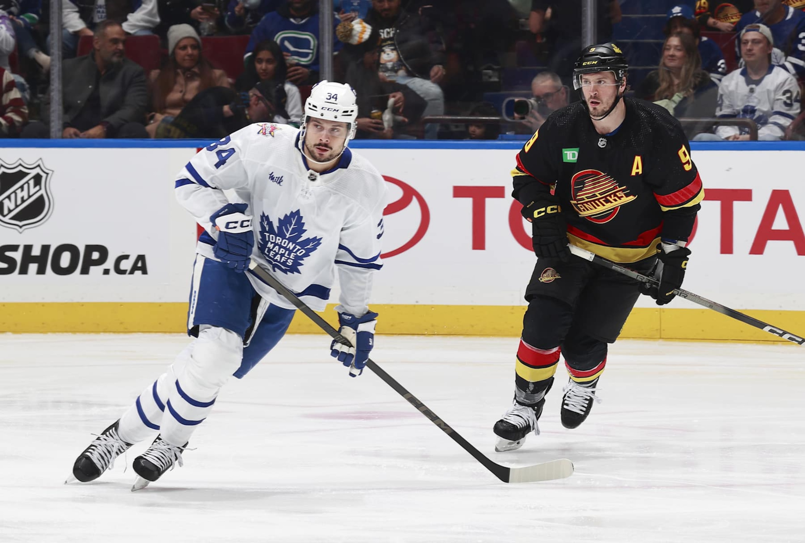 Toronto Maple Leafs center Auston Matthews (left) and Vancouver Canucks center J.T. Miller. 