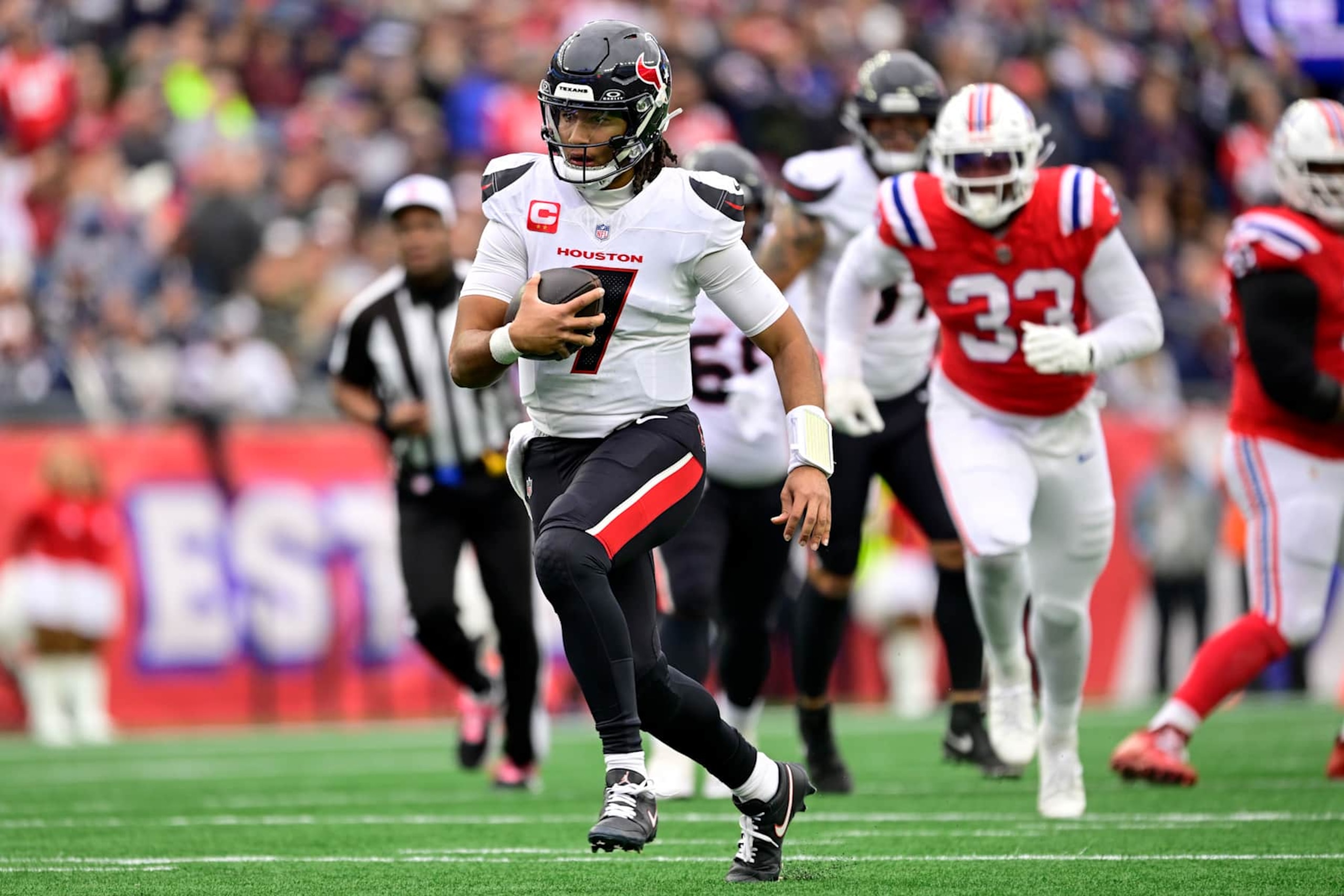 FOXBOROUGH, MASSACHUSETTS - OCTOBER 13: C.J. Stroud #7 of the Houston Texans carries the ball against the New England Patriots during the first half of the game at Gillette Stadium on October 13, 2024 in Foxborough, Massachusetts. (Photo by Maddie Malhotra/Getty Images)