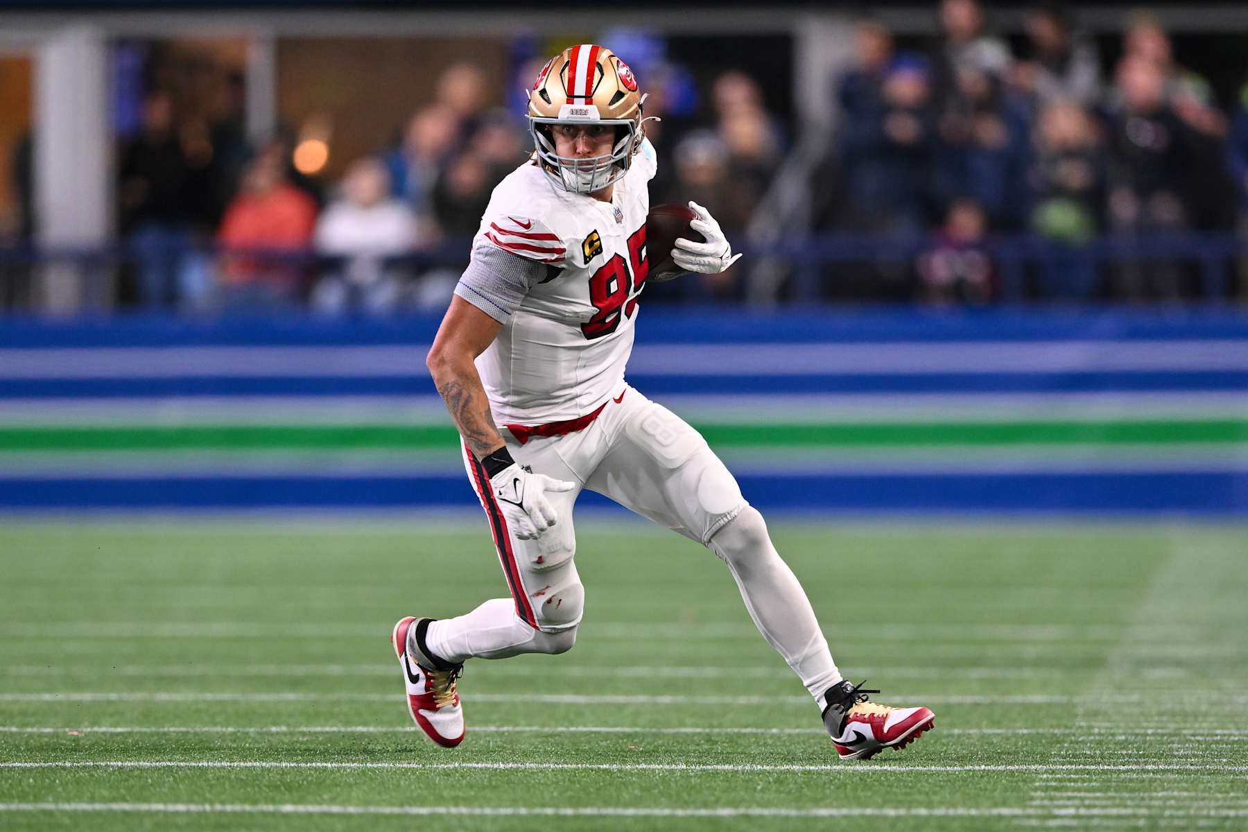 SEATTLE, WASHINGTON - OCTOBER 10: George Kittle #85 of the San Francisco 49ers runs the ball during the game against the Seattle Seahawks at Lumen Field on October 10, 2024 in Seattle, Washington. The San Francisco 49ers won 36-24. (Photo by Alika Jenner/Getty Images)