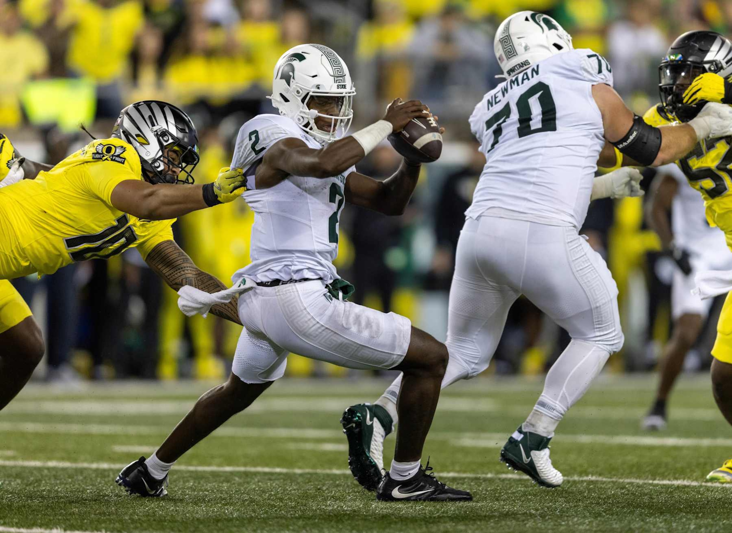EUGENE, OREGON - OCTOBER 4: Quarterback Aidan Chiles #2 of the Michigan State Spartan is sacked by defensive end Matayo Uiagalelei #10 of the Oregon Ducks during the first half at Autzen Stadium on October 4, 2024 in Eugene, Oregon.  (Photo by Tom Hauck/Getty Images)