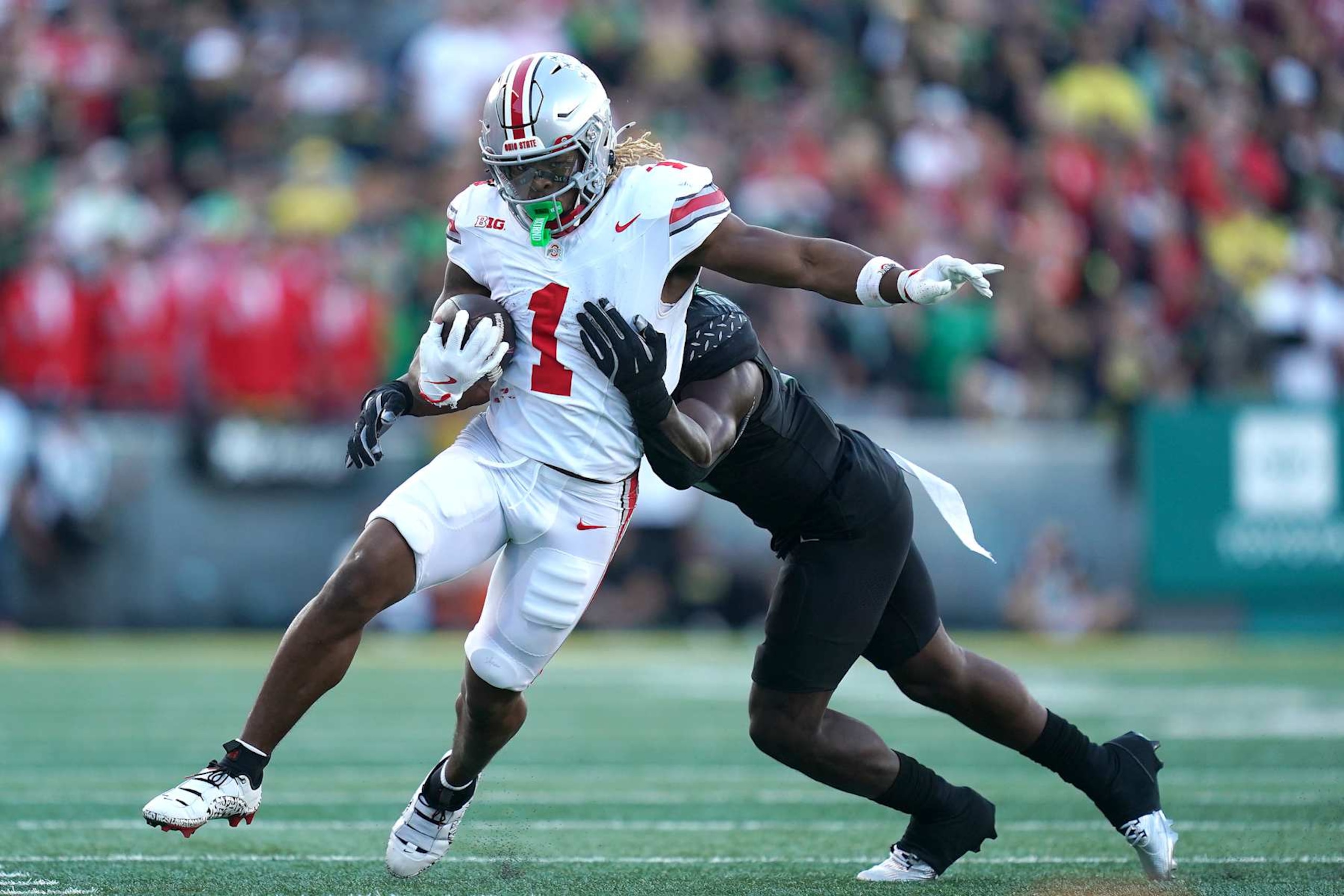 EUGENE, OREGON - OCTOBER 12: Quinshon Judkins #1 of the Ohio State Buckeyes runs the ball after a catch during the second quarter against the Oregon Ducks at Autzen Stadium on October 12, 2024 in Eugene, Oregon. (Photo by Ali Gradischer/Getty Images)