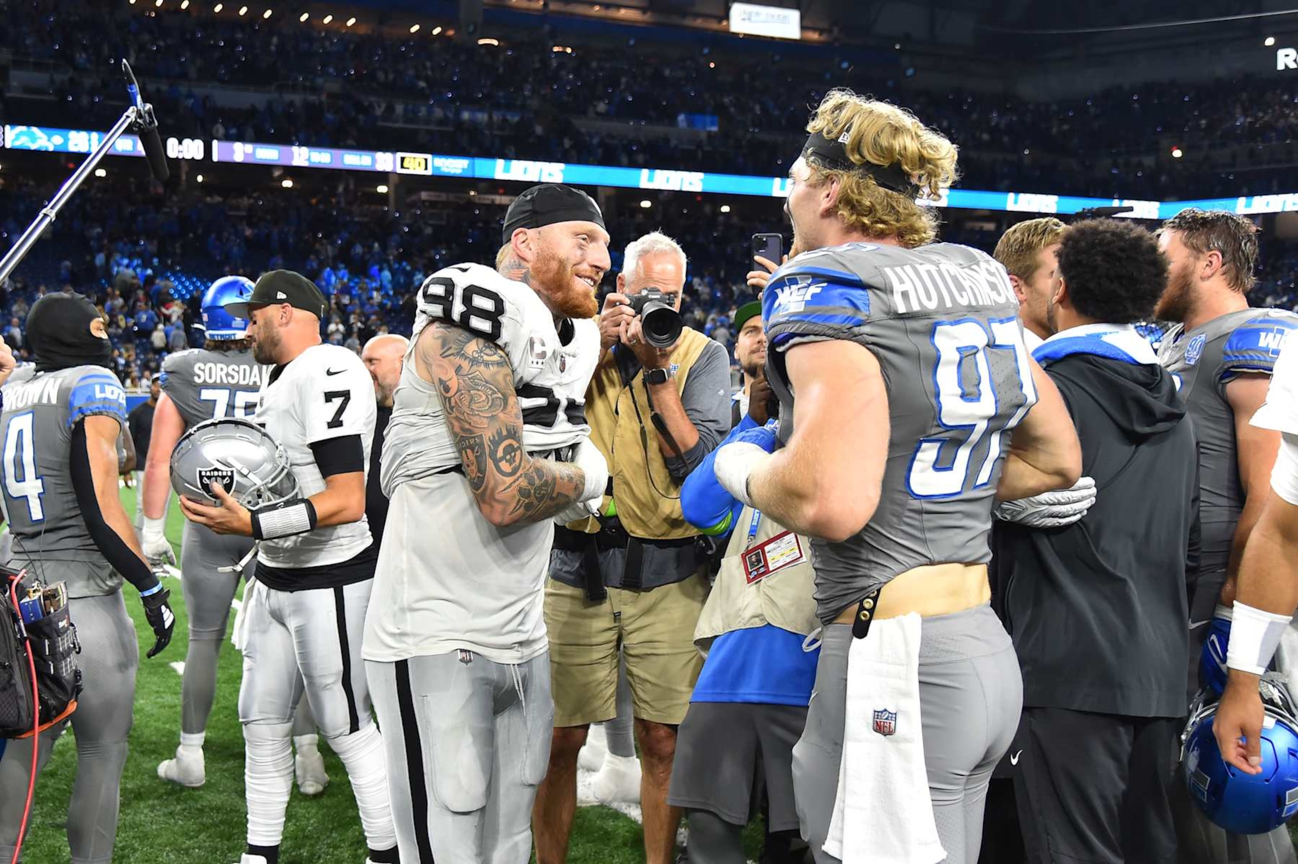 DETROIT, MI - OCTOBER 30: Las Vegas Raiders defensive end Maxx Crosby (98) and Detroit Lions defensive end Aidan Hutchinson (97) shake hands and trade jerseys following the Detroit Lions versus the Las Vegas Raiders game on Monday October 30, 2023 at Ford Field in Detroit, MI. (Photo by Steven King/Icon Sportswire via Getty Images)