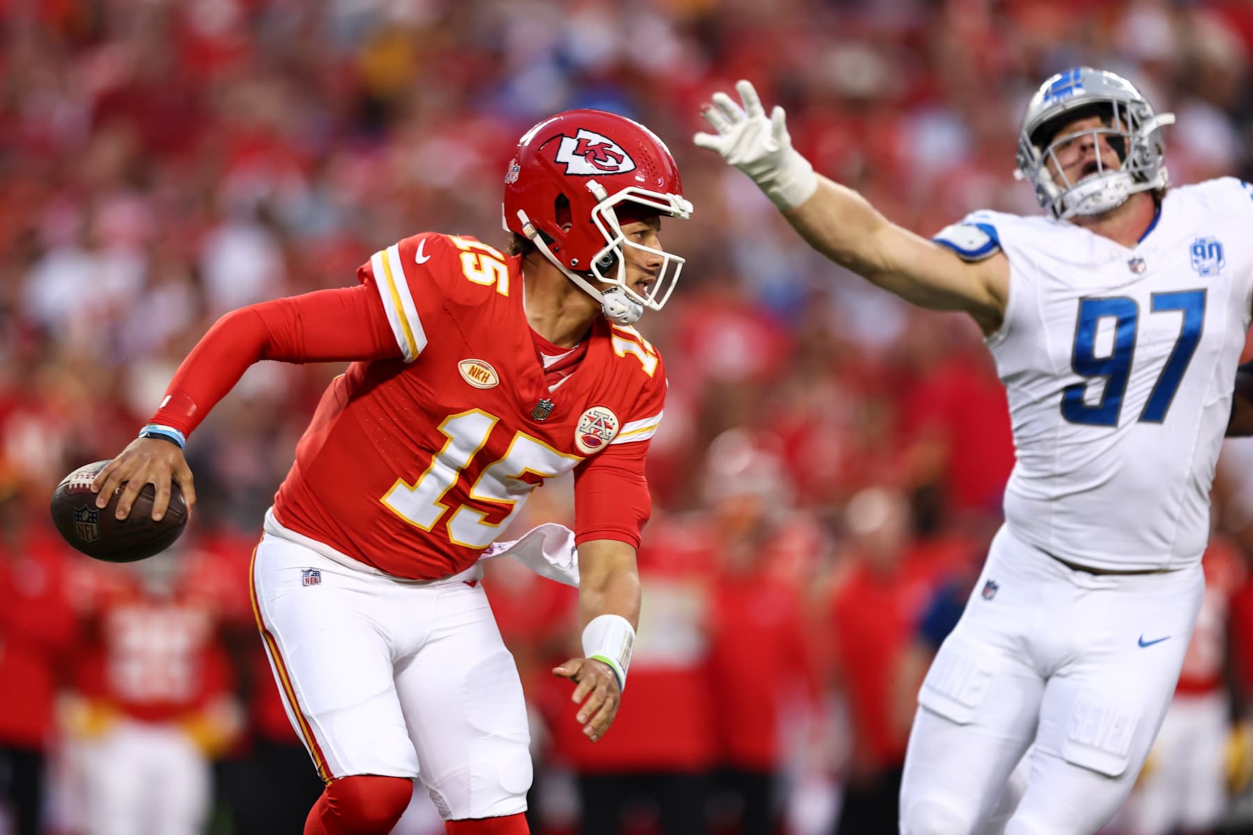KANSAS CITY, MO - SEPTEMBER 7: Patrick Mahomes #15 of the Kansas City Chiefs drops back to pass as Aidan Hutchinson #97 of the Detroit Lions chases during the first quarter of an NFL football game at GEHA Field at Arrowhead Stadium on September 7, 2023 in Kansas City, Missouri. (Photo by Kevin Sabitus/Getty Images)