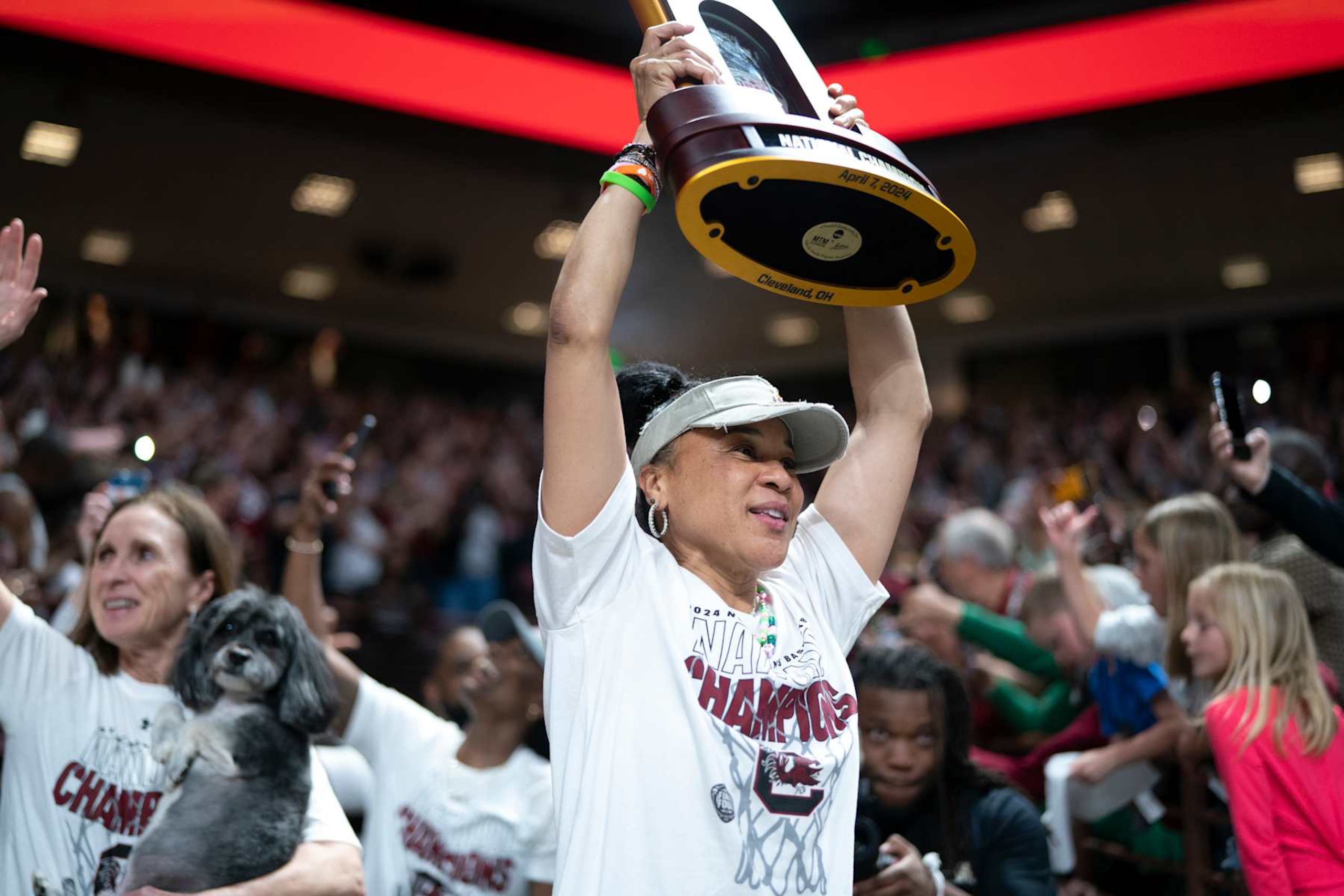 COLUMBIA, SOUTH CAROLINA - APRIL 8:  South Carolina coach Dawn Staley raises the NCAA Women's Basketball Championship trophy during a celebration at the Colonial Life Arena on April 8, 2024 in Columbia, South Carolina. University classes that were scheduled during the event were canceled. The South Carolina Gamecocks defeated the Iowa Hawkeyes 87-75 to cap a perfect season. 
 (Photo by Sean Rayford/Getty Images)
