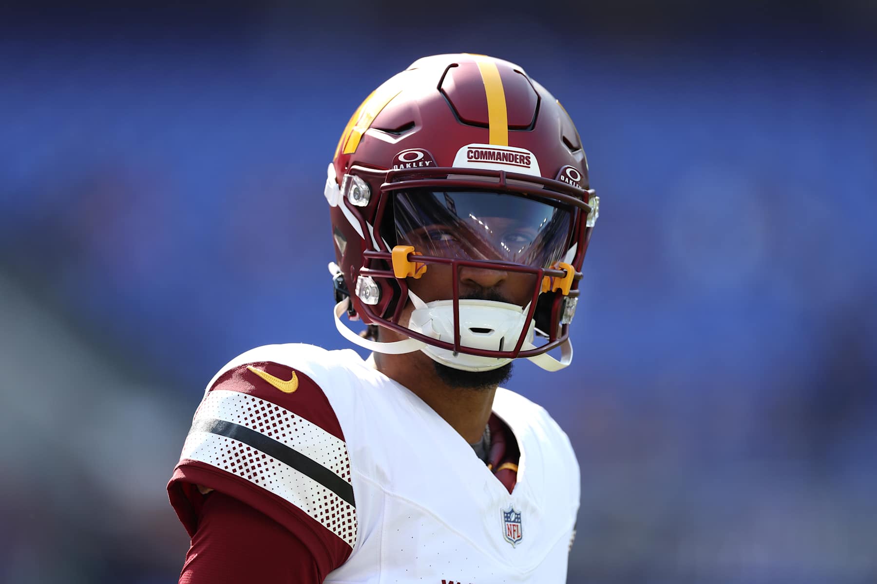 BALTIMORE, MARYLAND - OCTOBER 13: Jayden Daniels #5 of the Washington Commanders looks on prior to the game against the Baltimore Ravens at M&T Bank Stadium on October 13, 2024 in Baltimore, Maryland. (Photo by Patrick Smith/Getty Images)