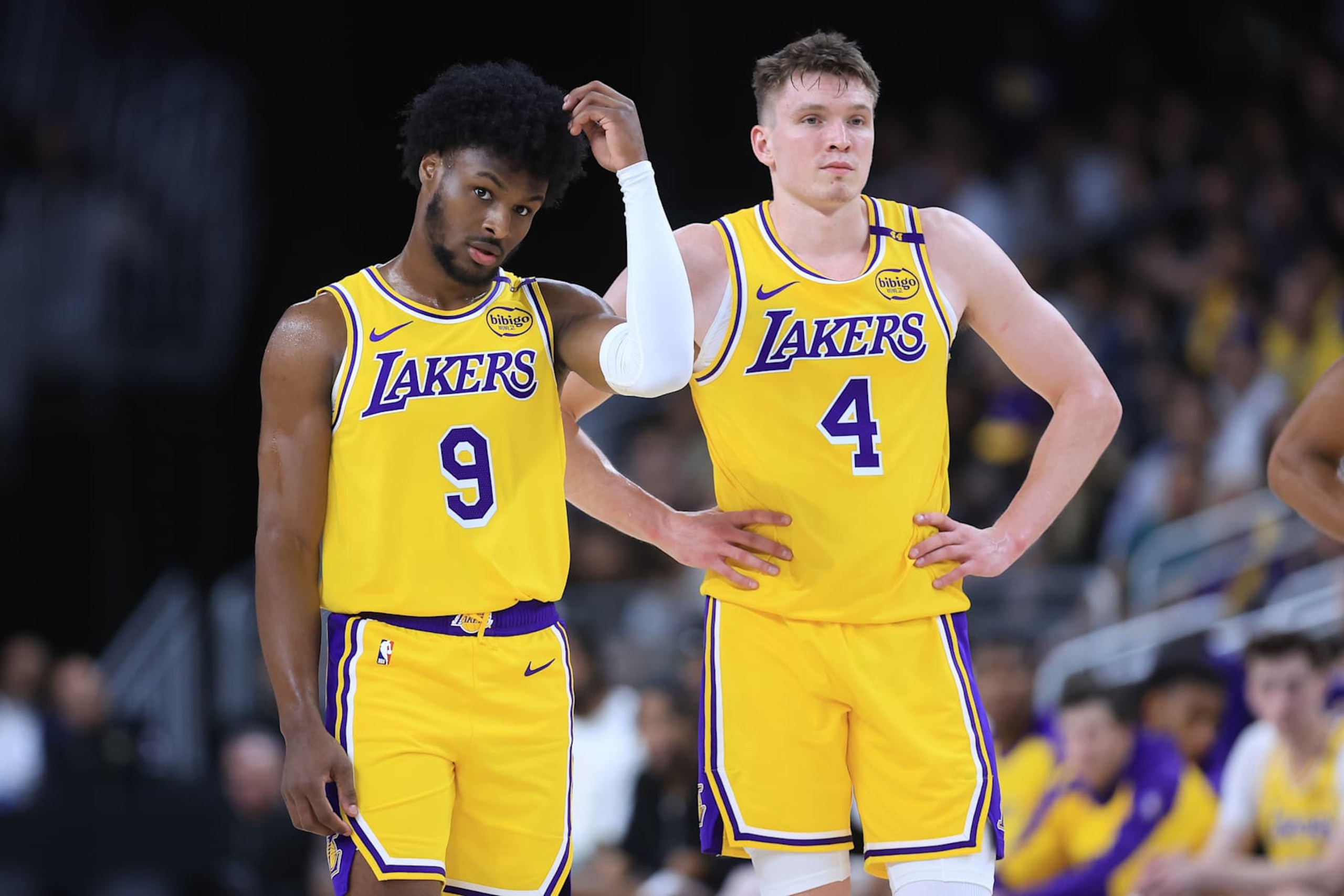 PALM SPRINGS, CALIFORNIA - OCTOBER 04: Bronny James #9 and Dalton Knecht #4 of the Los Angeles Lakers look on during the second half of a game against the Minnesota Timberwolves at Acrisure Arena on October 04, 2024 in Palm Springs, California.  (Photo by Sean M. Haffey/Getty Images)