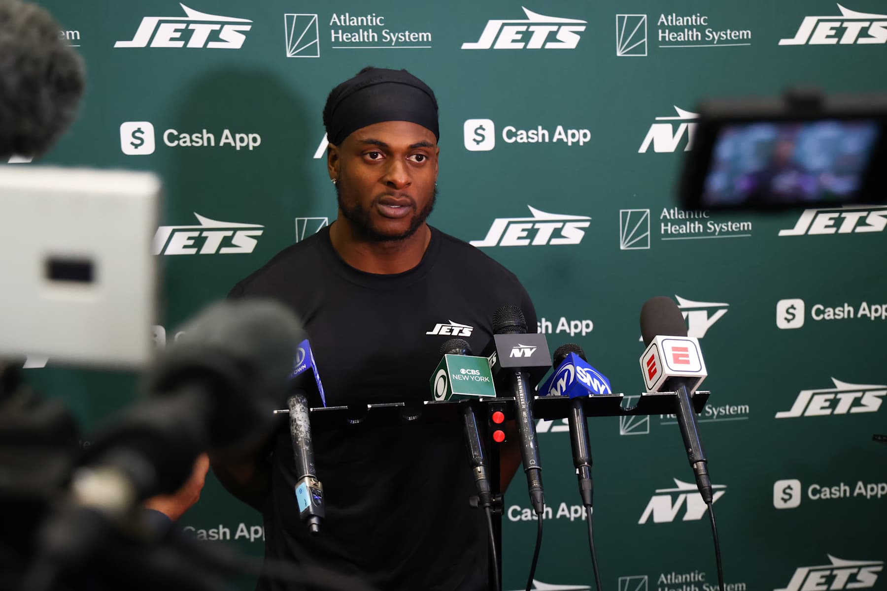 EAST RUTHERFORD, NEW JERSEY - OCTOBER 16: Davante Adams #17 of the New York Jets speaks to members of the media at the Atlantic Health Jets Training Center on October 16, 2024 in Florham Park, New Jersey. (Photo by Ed Mulholland/Getty Images)