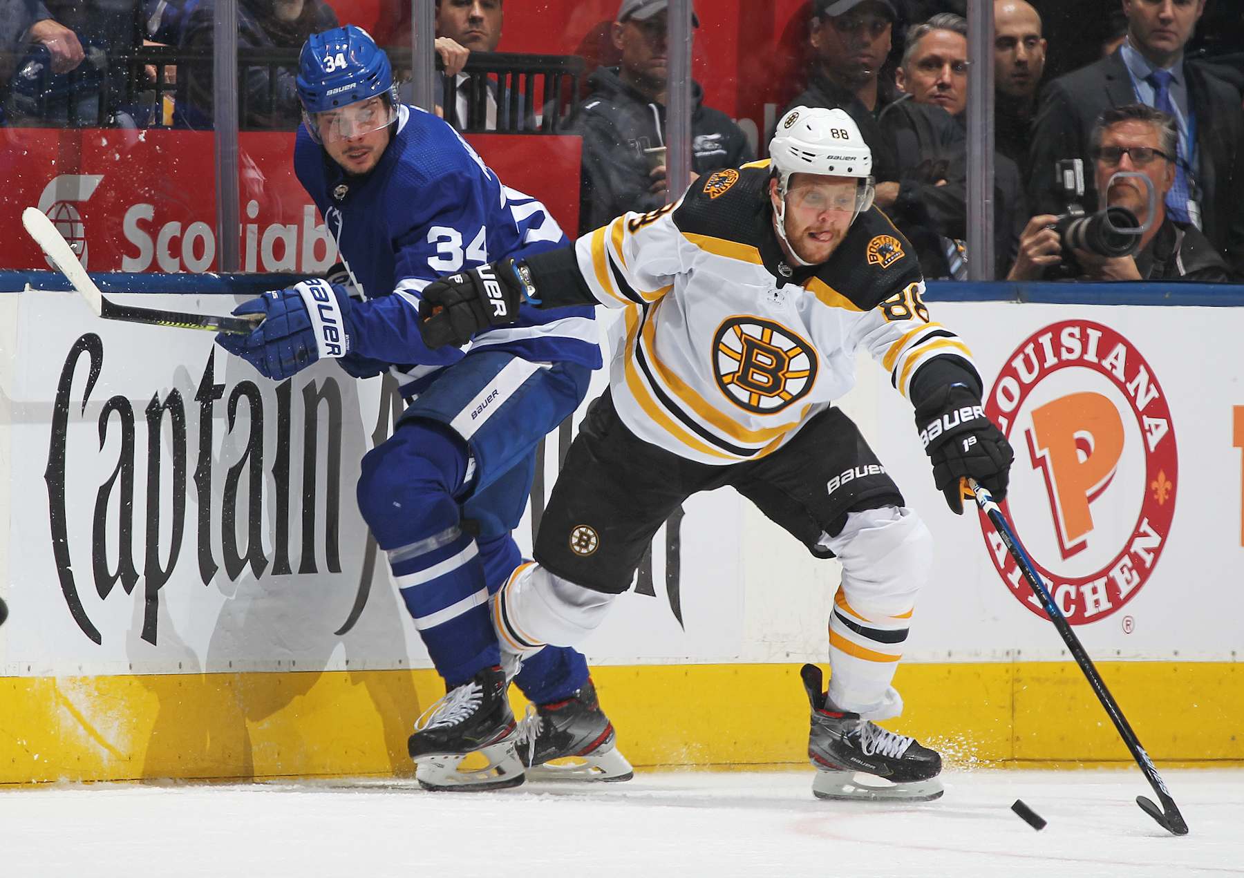 TORONTO, ON - APRIL 17: David Pastrnak #88 of the Boston Bruins battles against Auston Matthews #34 of the Toronto Maple Leafs in Game Four of the Eastern Conference First Round during the 2019 NHL Stanley Cup Playoffs at Scotiabank Arena on April 17, 2019 in Toronto, Ontario, Canada. The Bruins defeated the Maple Leafs 6-4. (Photo by Claus Andersen/Getty Images)