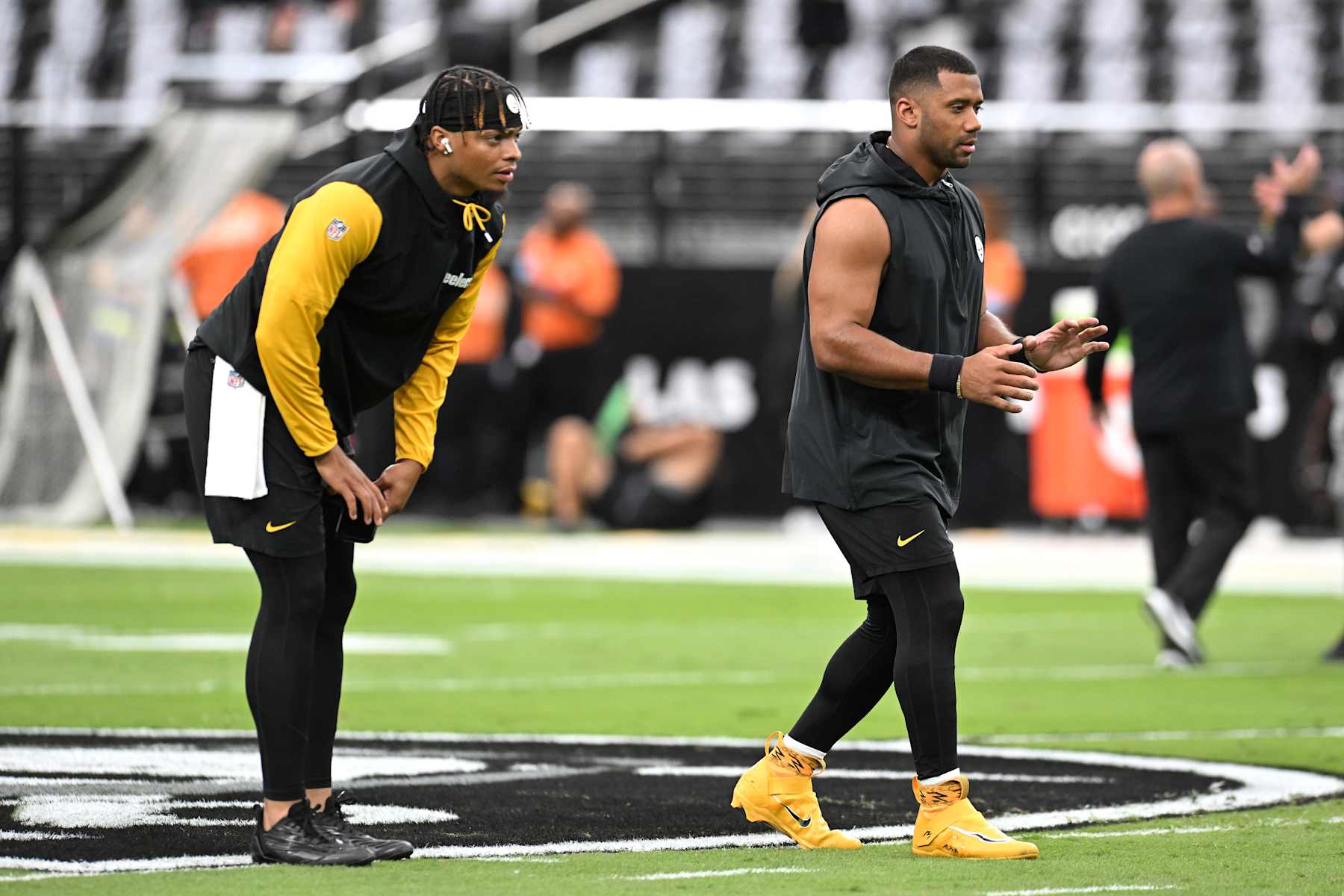 LAS VEGAS, NEVADA - OCTOBER 13: (L-R) Justin Fields #2 and Russell Wilson #3 of the Pittsburgh Steelers warm-up prior to a game against the Las Vegas Raiders at Allegiant Stadium on October 13, 2024 in Las Vegas, Nevada. (Photo by Candice Ward/Getty Images)