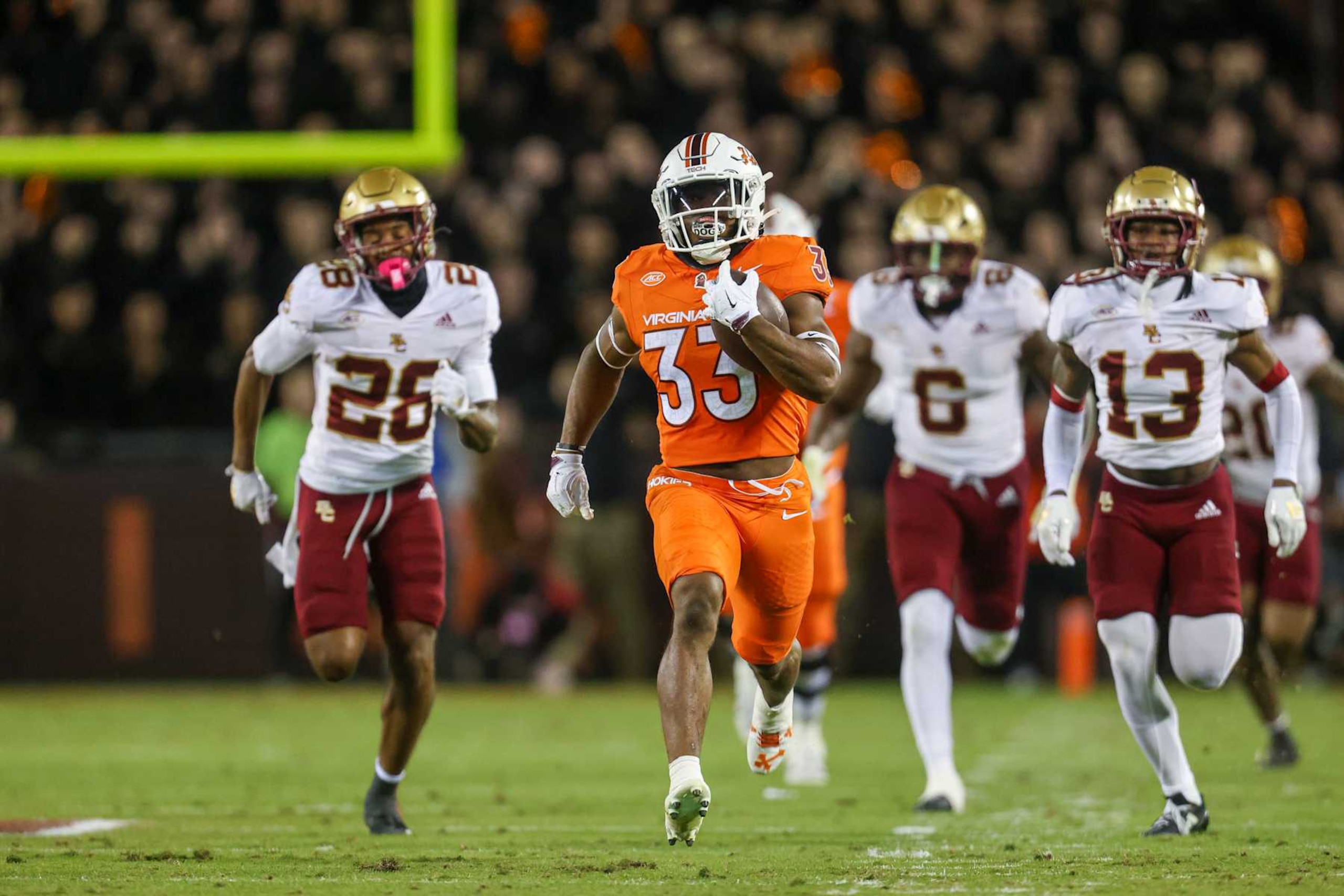BLACKSBURG, VIRGINIA - OCTOBER 17: Bhayshul Tuten #33 of the Virginia Tech Hokies runs the ball for a touchdown against the Boston College Eagles in the first half during a game at Lane Stadium on October 17, 2024 in Blacksburg, Virginia. (Photo by Ryan Hunt/Getty Images)
