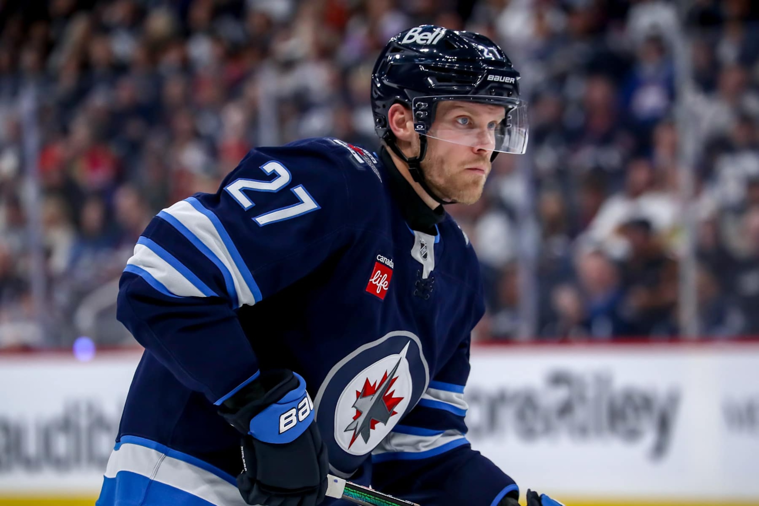 WINNIPEG, CANADA - OCTOBER 11: Nikolaj Ehlers #27 of the Winnipeg Jets keeps an eye on the play during third period action against the Chicago Blackhawks at the Canada Life Centre on October 11, 2024 in Winnipeg, Manitoba, Canada. The Jets defeated the Hawks 2-1 in overtime. (Photo by Darcy Finley/NHLI via Getty Images)
