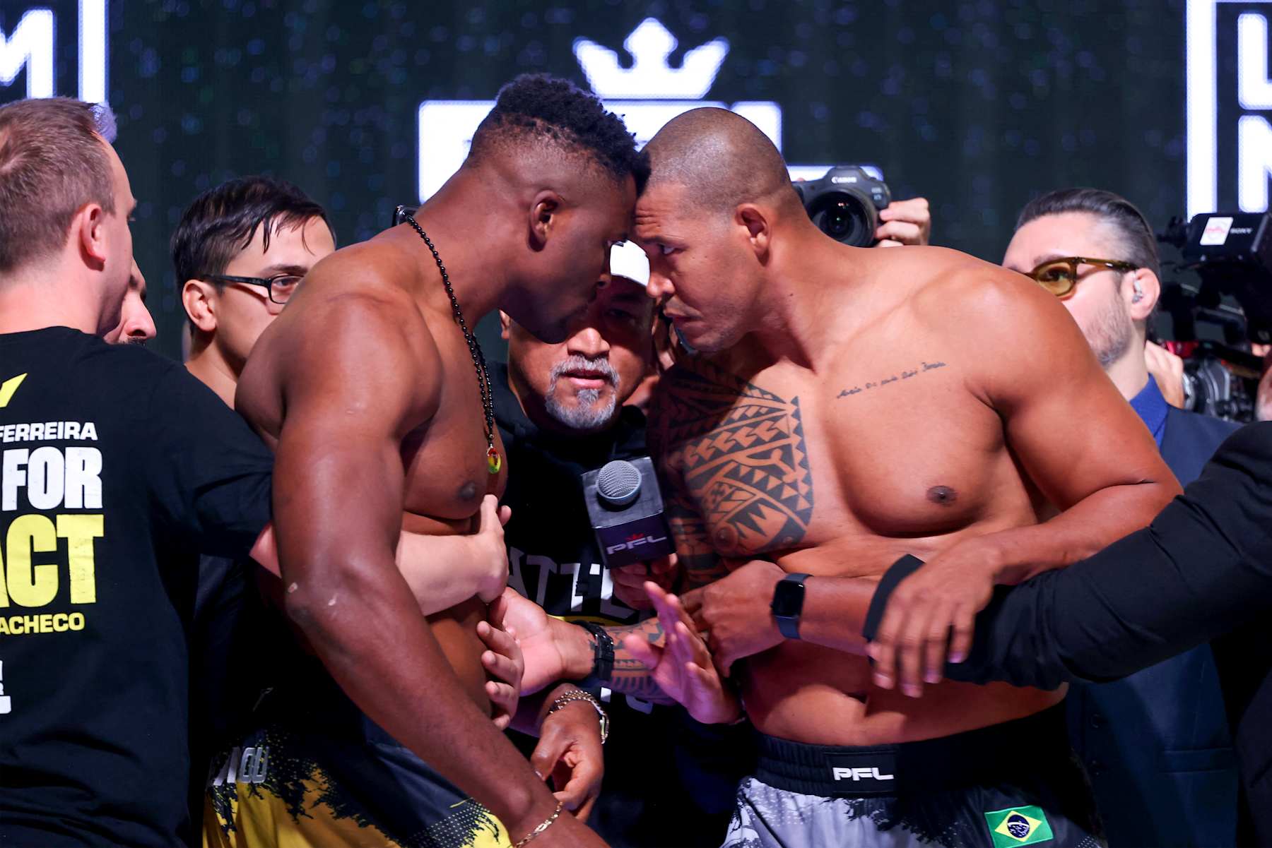 Francis Ngannou and Renan Ferreira stare each other down