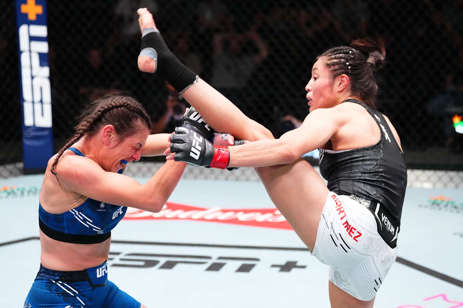 LAS VEGAS, NEVADA - OCTOBER 19: (R-L) Melissa Martinez of Mexico kicks Alice Ardelean of Romania in a strawweight fight during the UFC Fight Night event at UFC APEX on October 19, 2024 in Las Vegas, Nevada. (Photo by Jeff Bottari/Zuffa LLC)