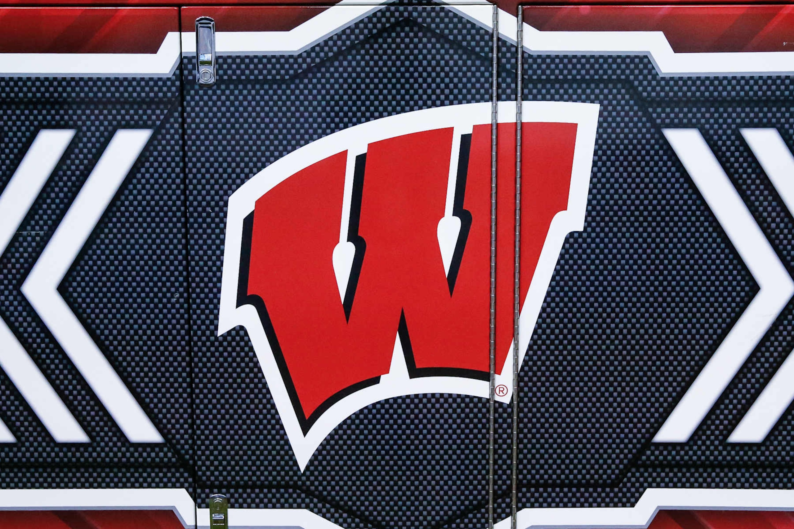 PHOENIX, AZ - DECEMBER 27: The Wisconsin Badgers logo before the college football Guaranteed Rate Bowl game between the Wisconsin Badgers and the Oklahoma State Cowboys on December 27, 2022 at Chase Field in Phoenix, Arizona. (Photo by Kevin Abele/Icon Sportswire via Getty Images) PHOENIX, AZ - DECEMBER 27: The Wisconsin Badgers logo before the college football Guaranteed Rate Bowl game between the Wisconsin Badgers and the Oklahoma State Cowboys on December 27, 2022 at Chase Field in Phoenix, Arizona. (Photo by Kevin Abele/Icon Sportswire via Getty Images)