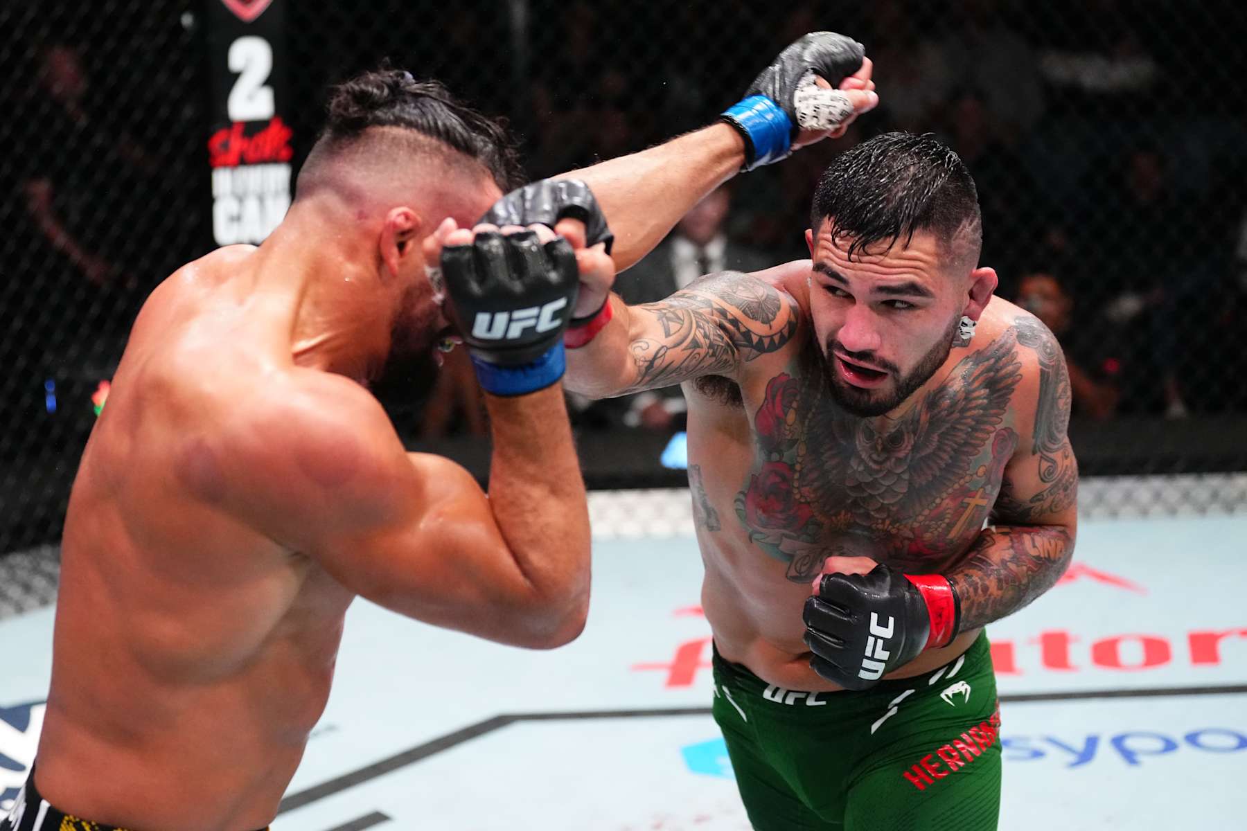 LAS VEGAS, NEVADA - OCTOBER 19: (R-L) Anthony Hernandez punches Michel Pereira of Brazil in a middleweight fight during the UFC Fight Night event at UFC APEX on October 19, 2024 in Las Vegas, Nevada. (Photo by Jeff Bottari/Zuffa LLC)