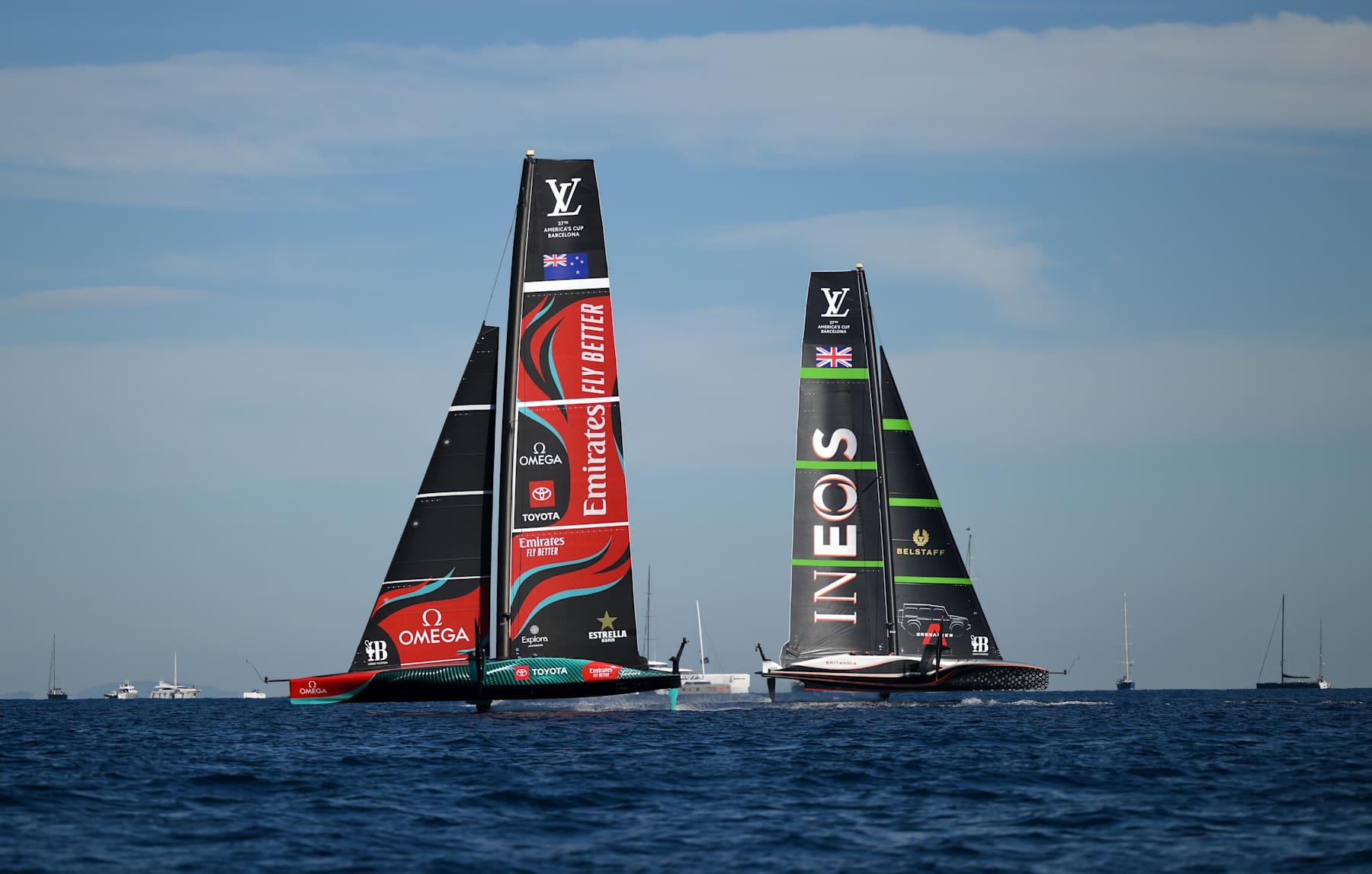 BARCELONA, SPAIN - OCTOBER 19: Crews of Emirates Team New Zealand and Team Ineos Britannia compete during the race between Emirates Team New Zealand and Team Ineos Britannia in the 37th America's Cup on October 19, 2024 in Barcelona, Spain. (Photo by David Ramos/Getty Images)