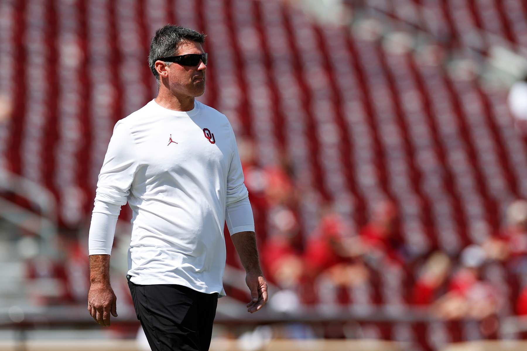 NORMAN, OKLAHOMA - SEPTEMBER 14: Offensive coordinator and quarterbacks coach Seth Littrell of the Oklahoma Sooners on the field for warm ups prior to a game against the Tulane Green Wave at Gaylord Family Oklahoma Memorial Stadium on September 14, 2024 in Norman, Oklahoma. (Photo by Aaron M. Sprecher/Getty Images)