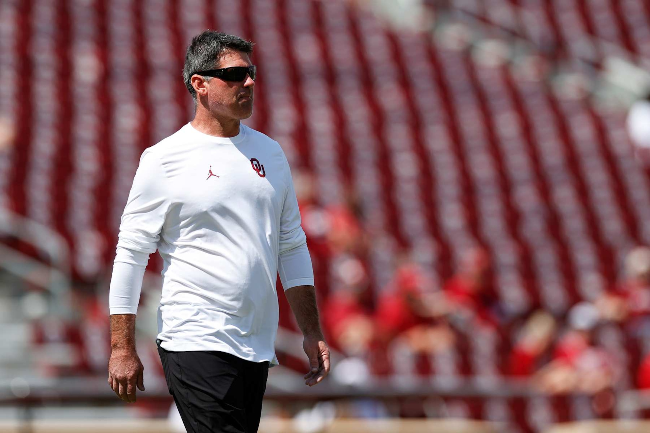 NORMAN, OKLAHOMA - SEPTEMBER 14: Offensive coordinator and quarterbacks coach Seth Littrell of the Oklahoma Sooners on the field for warm ups prior to a game against the Tulane Green Wave at Gaylord Family Oklahoma Memorial Stadium on September 14, 2024 in Norman, Oklahoma. (Photo by Aaron M. Sprecher/Getty Images)