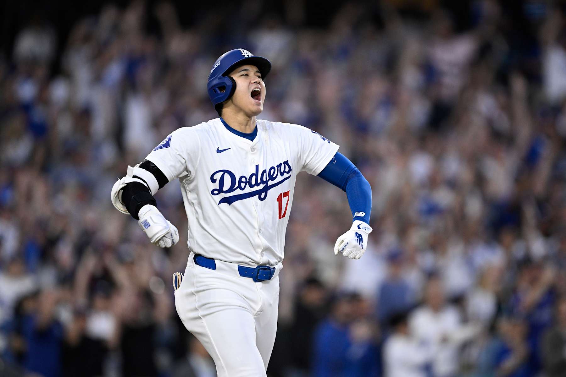 LOS ANGELES, CALIFORNIA - OCTOBER 05: Shohei Ohtani #17 of the Los Angeles Dodgers celebrates a three run home run during the second inning against the San Diego Padres in Game One of the Division Series at Dodger Stadium on October 05, 2024 in Los Angeles, California.  (Photo by Orlando Ramirez/Getty Images)