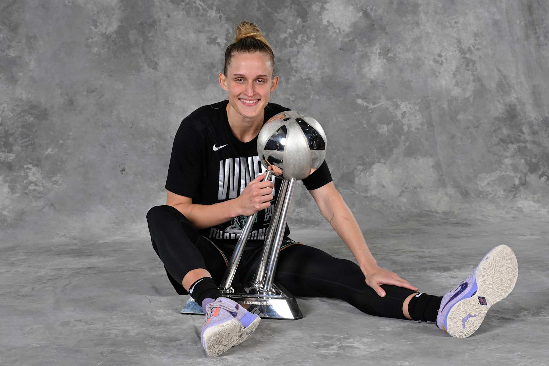 BROOKLYN, NY - OCTOBER 20: Leonie Fiebich #13 of the New York Liberty poses for a portrait with the 2024 WNBA Championship trophy after winning the 2024 WNBA Championship on October 20, 2024 in Brooklyn, New York. NOTE TO USER: User expressly acknowledges and agrees that, by downloading and or using this photograph, user is consenting to the terms and conditions of the Getty Images License Agreement. Mandatory Copyright Notice: Copyright 2024 NBAE (Photo by David Dow/NBAE via Getty Images)