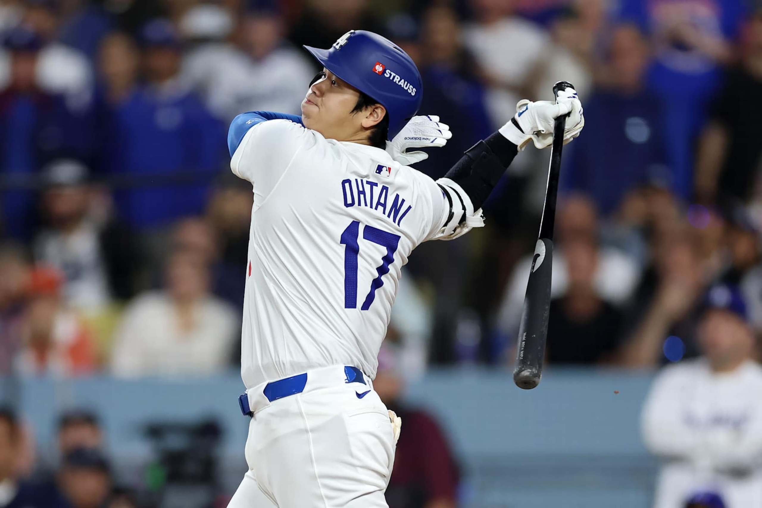 LOS ANGELES, CALIFORNIA - OCTOBER 20:  Shohei Ohtani #17 of the Los Angeles Dodgers connects for an RBI single during the 6th inning of Game Six of the National League Championship Series against the New York Mets at Dodger Stadium on October 20, 2024 in Los Angeles, California. (Photo by Sean M. Haffey/Getty Images)