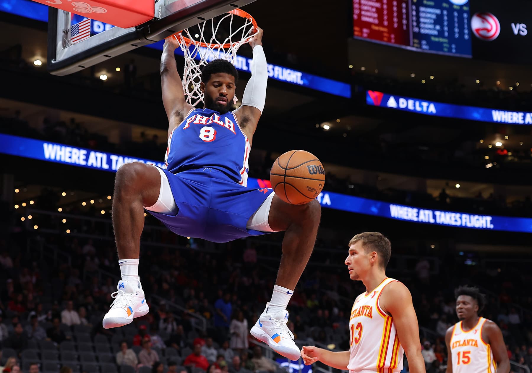 ATLANTA, GEORGIA - OCTOBER 14:  Paul George #8 of the Philadelphia 76ers dunks against the Atlanta Hawks during the first quarter at State Farm Arena on October 14, 2024 in Atlanta, Georgia.  NOTE TO USER: User expressly acknowledges and agrees that, by downloading and/or using this photograph, user is consenting to the terms and conditions of the Getty Images License Agreement.  (Photo by Kevin C. Cox/Getty Images)