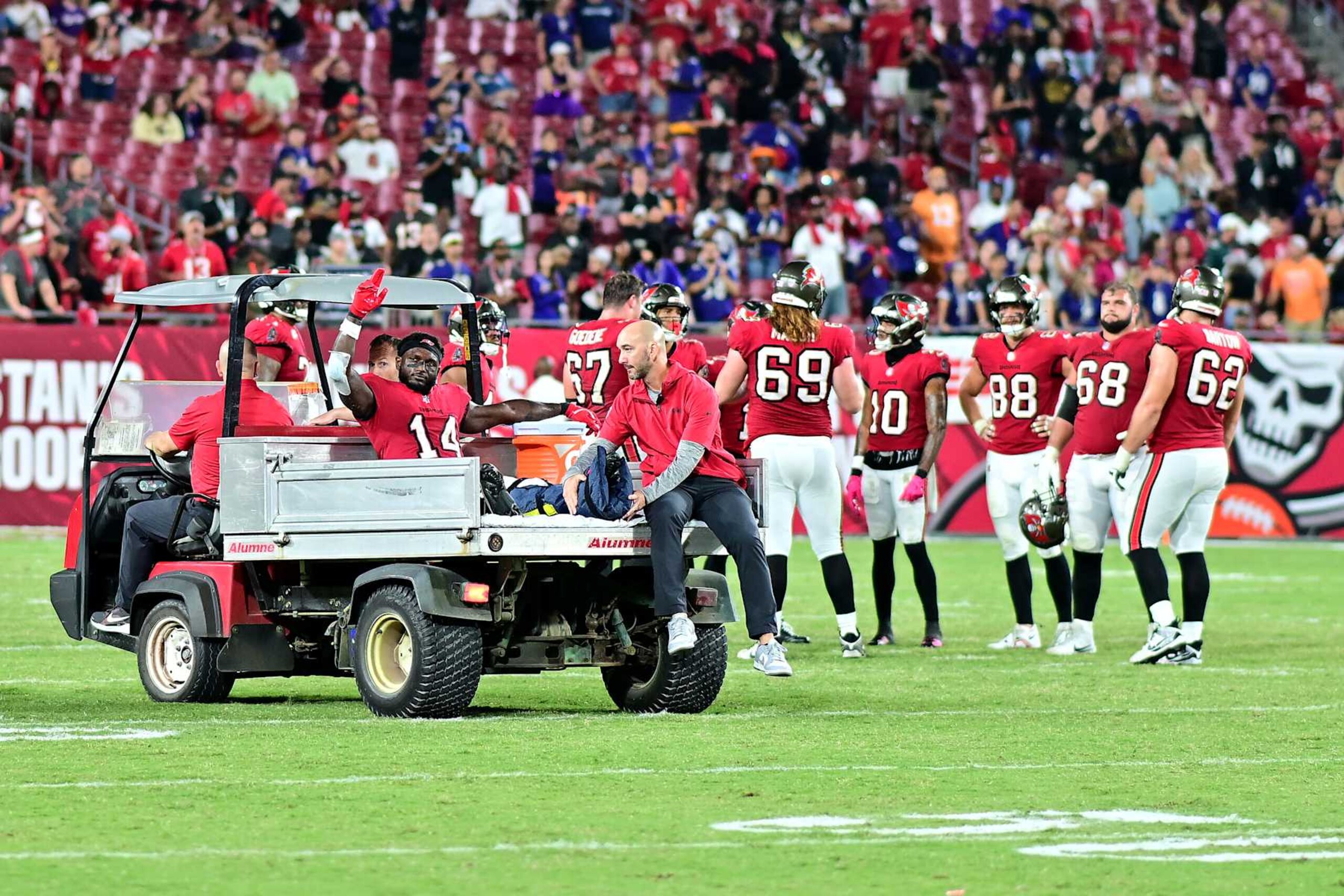 TAMPA, FLORIDA - OCTOBER 21: Chris Godwin #14 of the Tampa Bay Buccaneers reacts as he is carted off the field after being injured during the fourth quarter against the Baltimore Ravens at Raymond James Stadium on October 21, 2024 in Tampa, Florida. Baltimore defeated Tampa Bay 41-31. (Photo by Julio Aguilar/Getty Images)