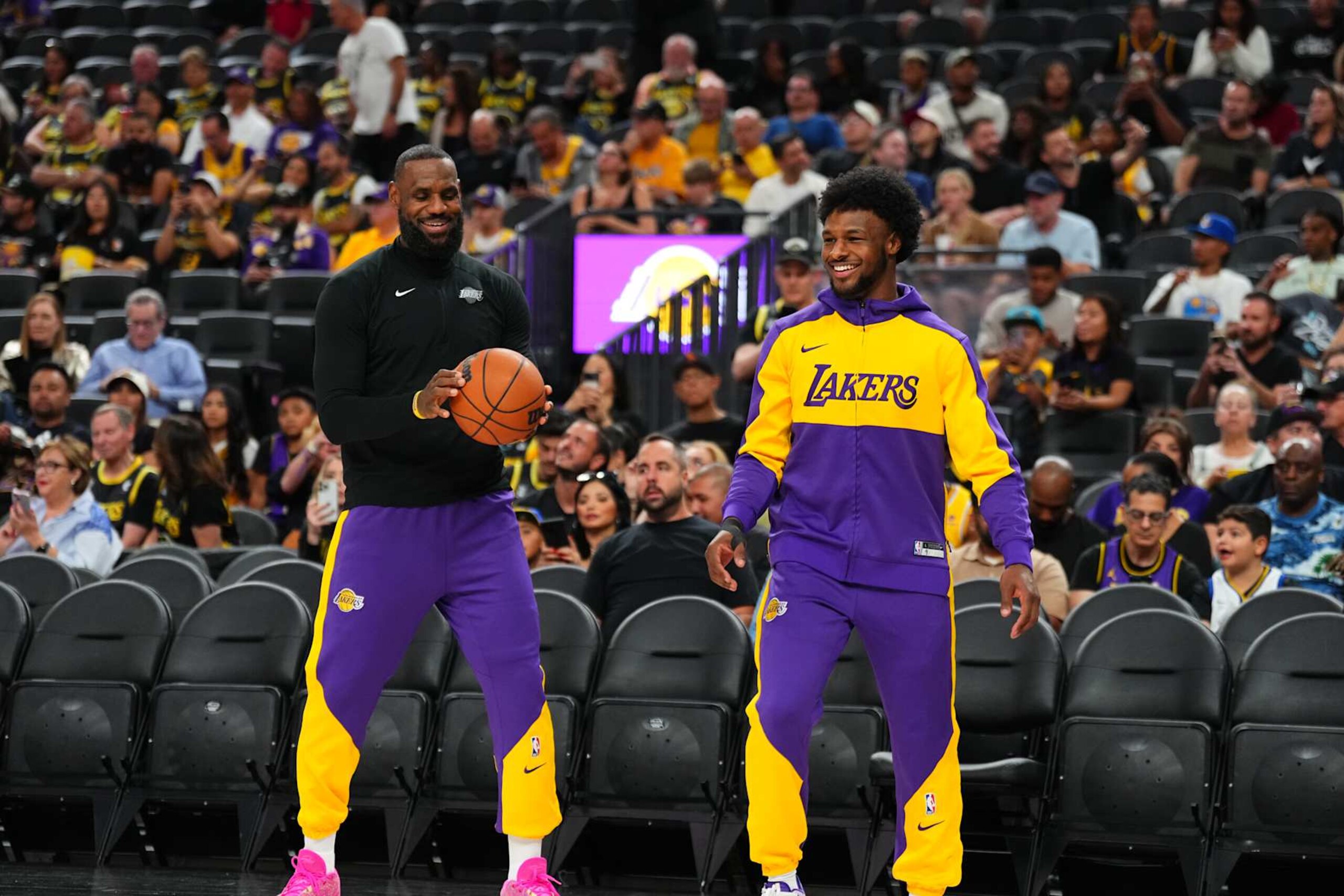 LAS VEGAS, NV - OCTOBER 15: LeBron James #23 and Bronny James #9 of the Los Angeles Lakers warms up before the game before the game against the Golden State Warriors during the 2024 NBA Preseason on October 15, 2024 at T-Mobile Arena in Las Vegas, Nevada. NOTE TO USER: User expressly acknowledges and agrees that, by downloading and or using this photograph, User is consenting to the terms and conditions of the Getty Images License Agreement. Mandatory Copyright Notice: Copyright 2024 NBAE  (Photo by Jeff Bottari/NBAE via Getty Images)