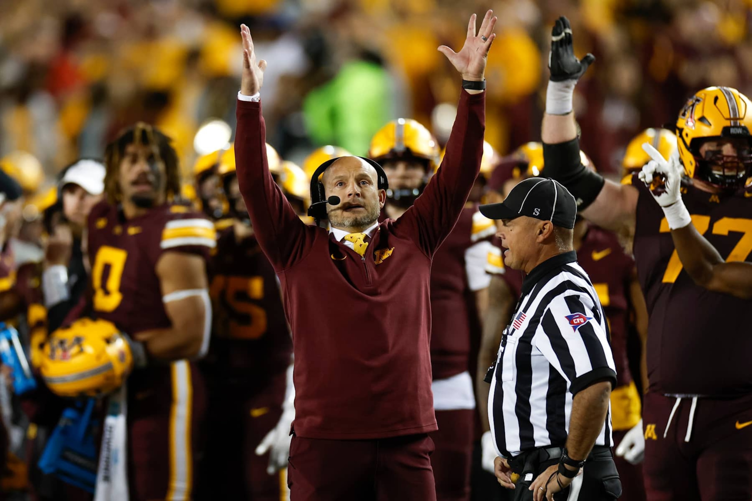 MINNEAPOLIS, MINNESOTA - OCTOBER 05: Head coach P.J. Fleck of the Minnesota Golden Gophers gestures for a touchdown in the fourth quarter during a game against the USC Trojans at Huntington Bank Stadium on October 5, 2024 in Minneapolis, Minnesota. (Photo by Brandon Sloter/Image Of Sport/Getty Images)