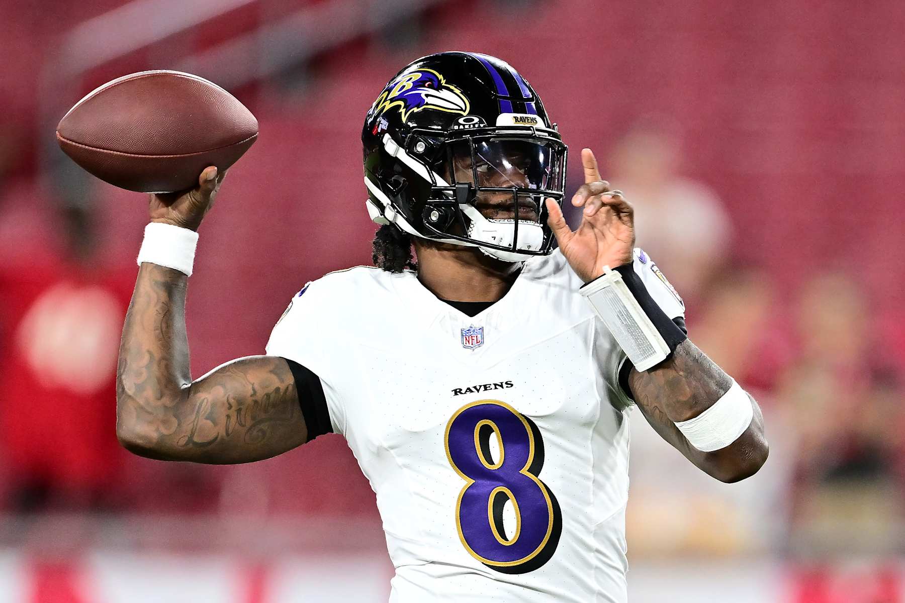 TAMPA, FLORIDA - OCTOBER 21: Lamar Jackson #8 of the Baltimore Ravens warms up prior to a game against the Tampa Bay Buccaneers at Raymond James Stadium on October 21, 2024 in Tampa, Florida. (Photo by Julio Aguilar/Getty Images)