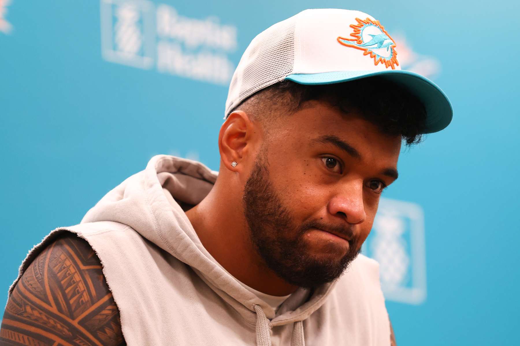 MIAMI GARDENS, FLORIDA - OCTOBER 21: Quarterback Tua Tagovailoa of the Miami Dolphins addresses the media at Baptist Health Training Complex on October 21, 2024 in Miami Gardens, Florida.  (Photo by Megan Briggs/Getty Images)