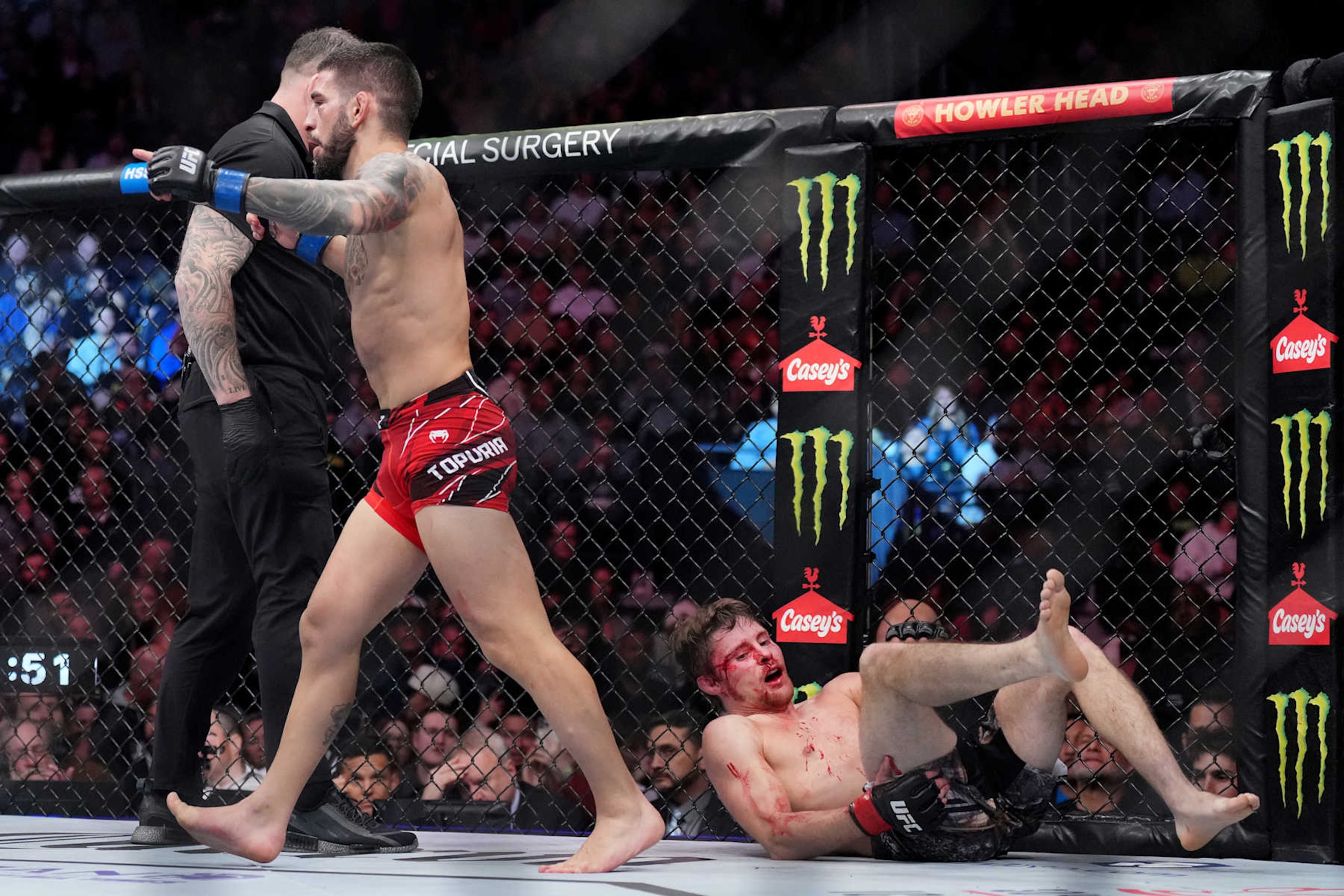 Ilia Topuria reacts after defeating Bryce Mitchell by submission